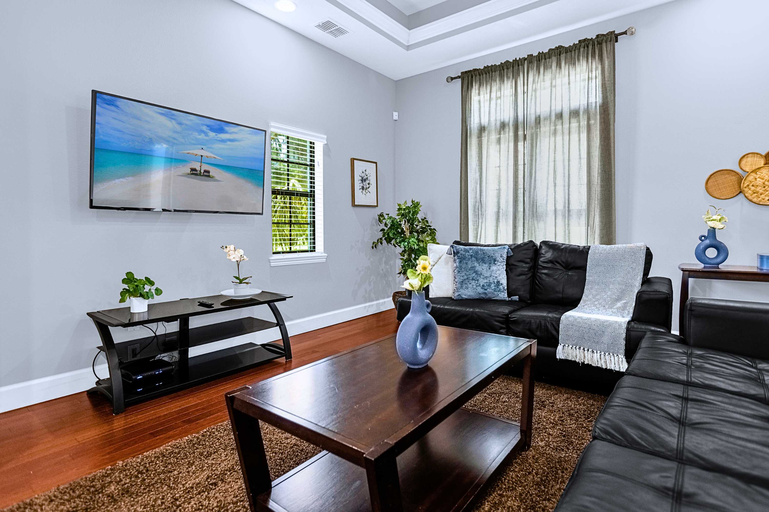 A serene sitting area featuring clean neutral tones and plush seating