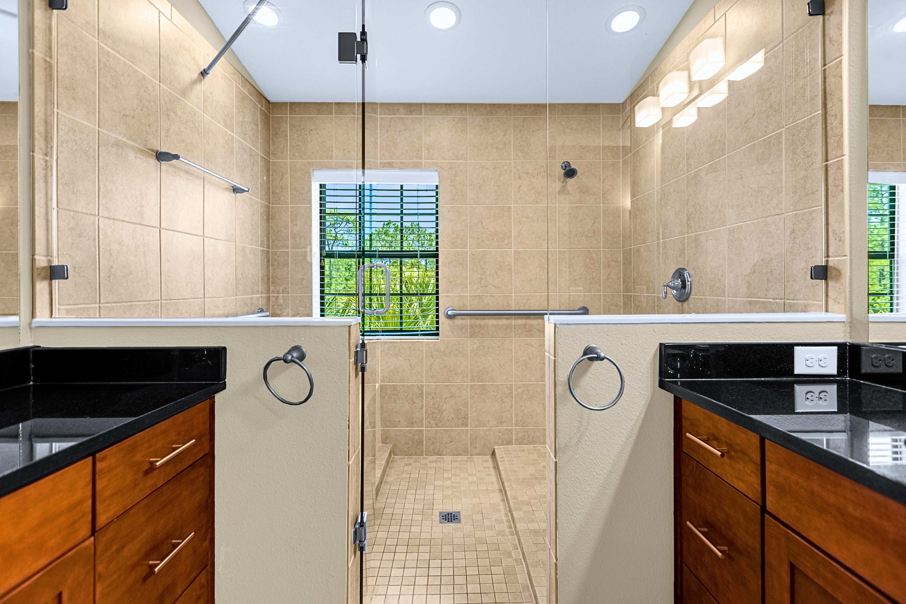 Modern bathroom setup featuring updated fixtures and generous counter space
