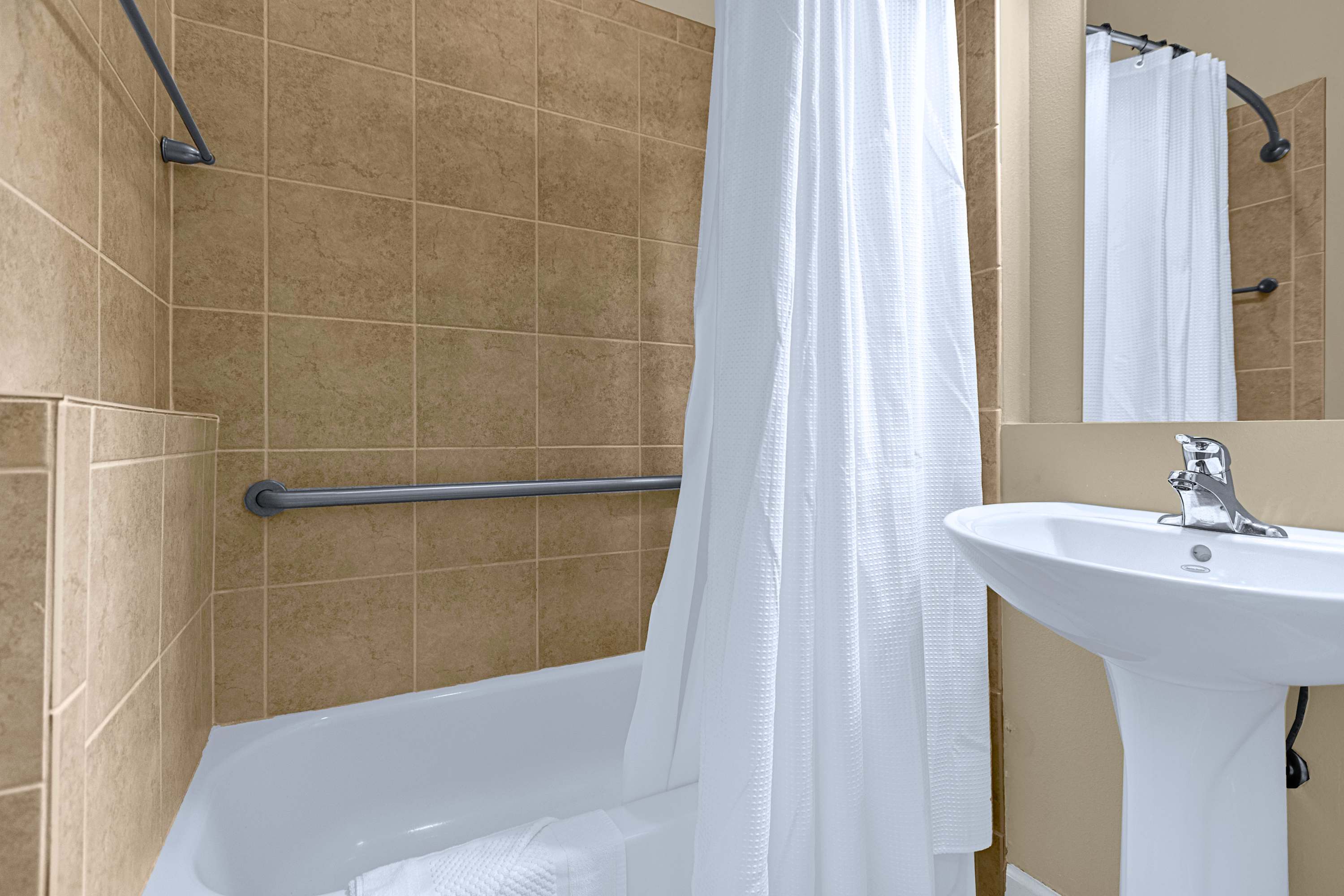 A well-appointed bathroom equipped with modern fixtures and crisp towels