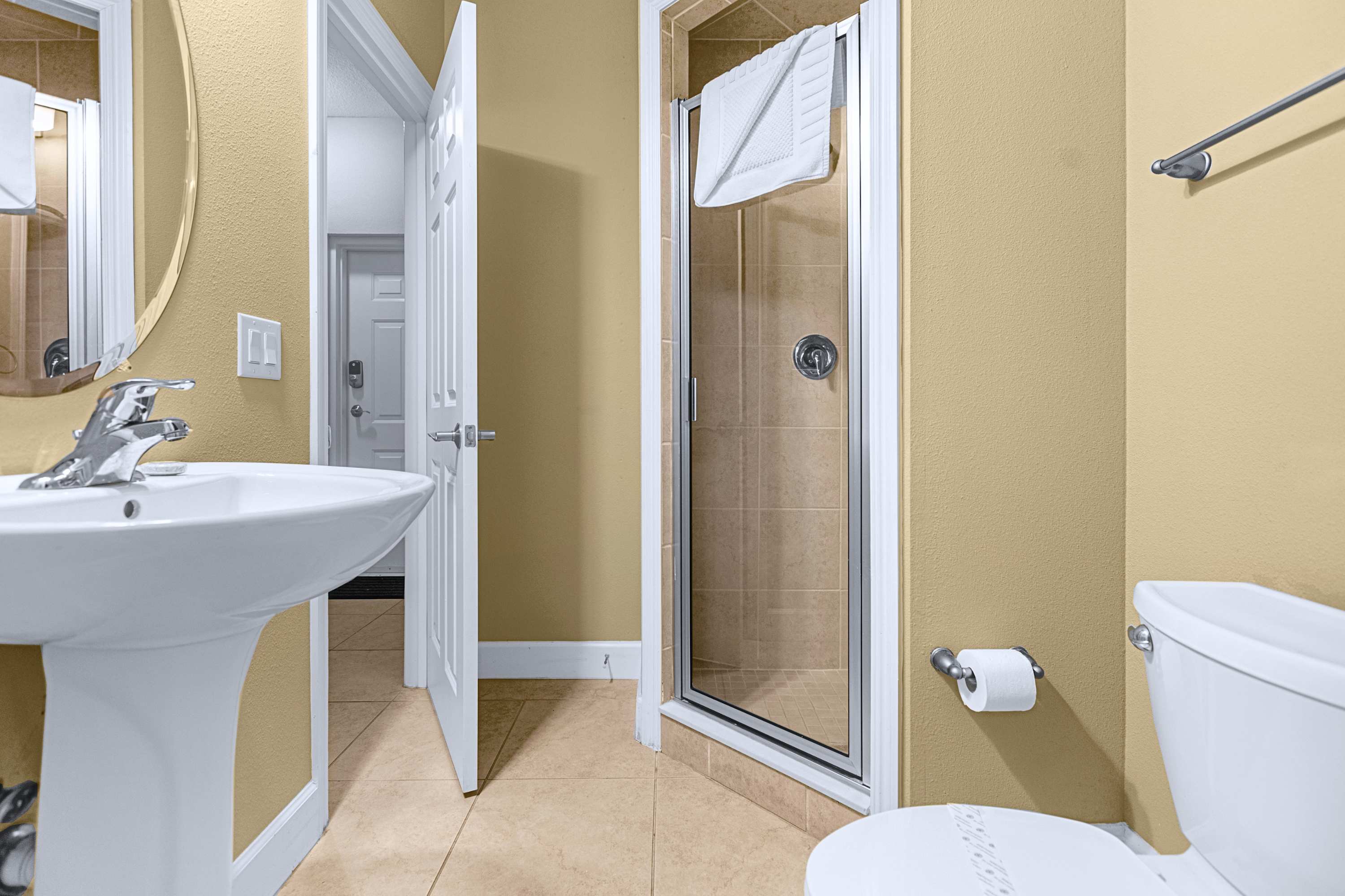 Modern bathroom setup featuring updated fixtures and generous counter space
