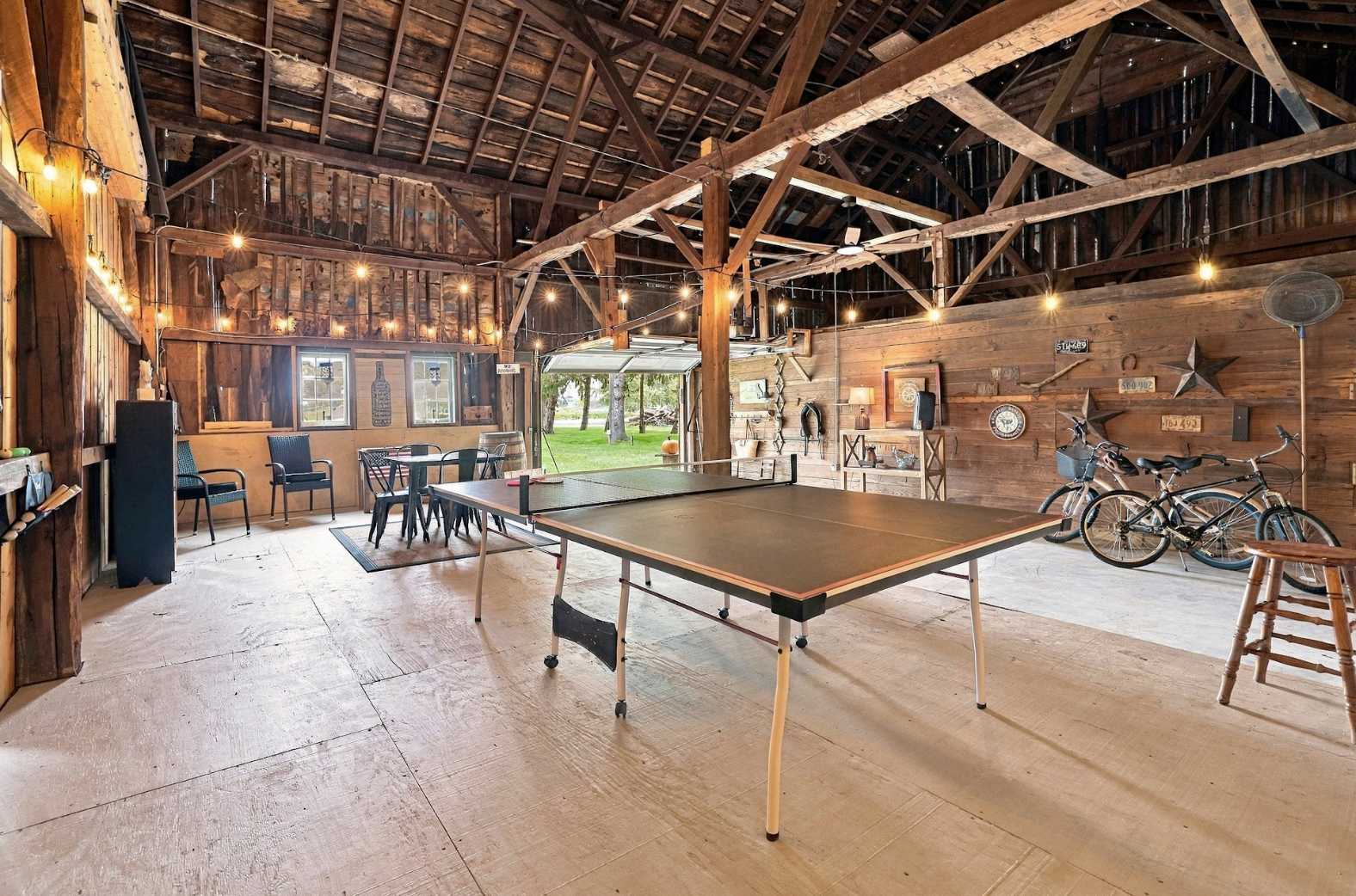 Barn game room with ping pong and bikes ready for Harbor Country rides.