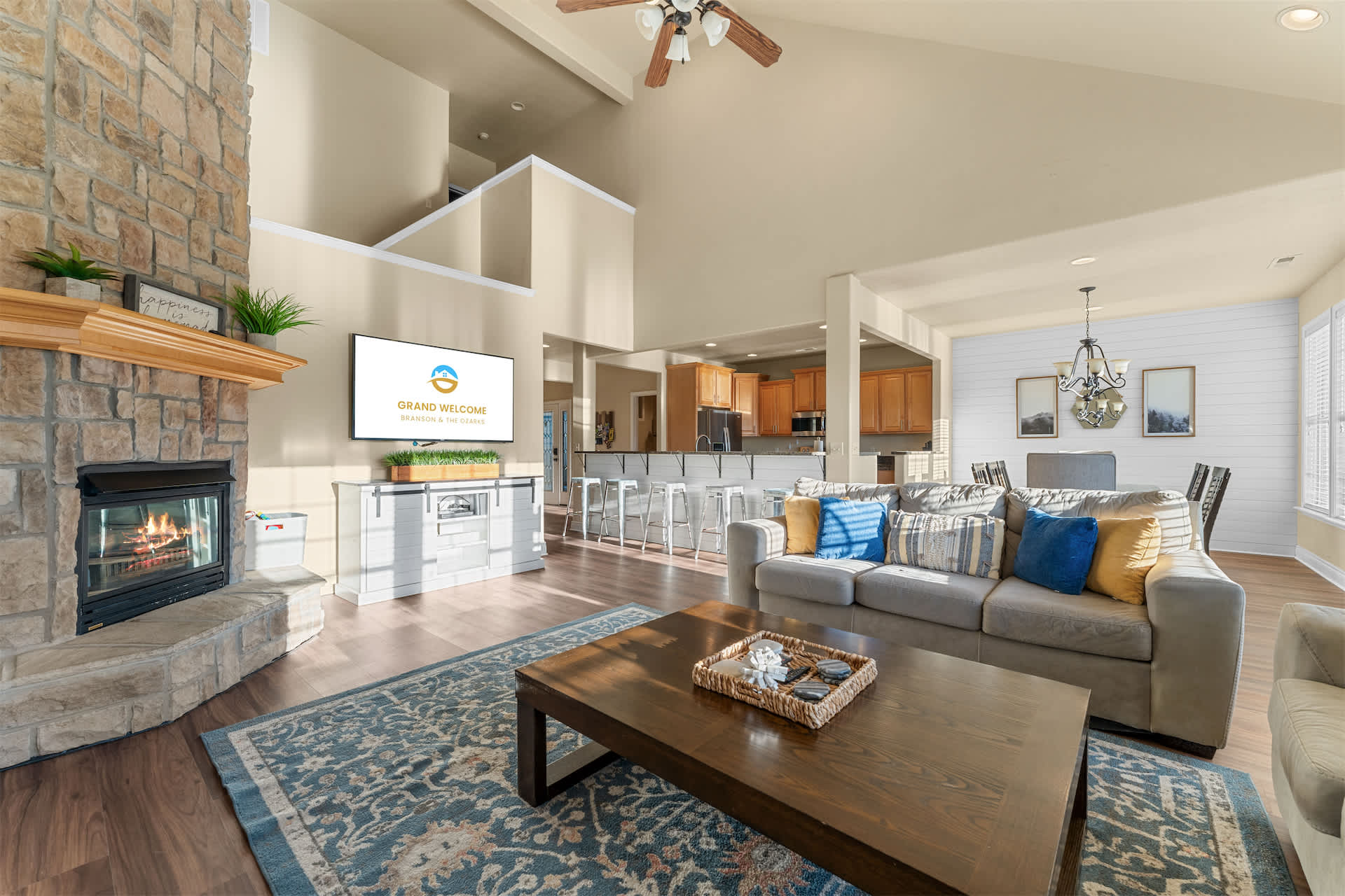 Gather and relax in the bright living room featuring high ceilings, couches, and a Smart TV