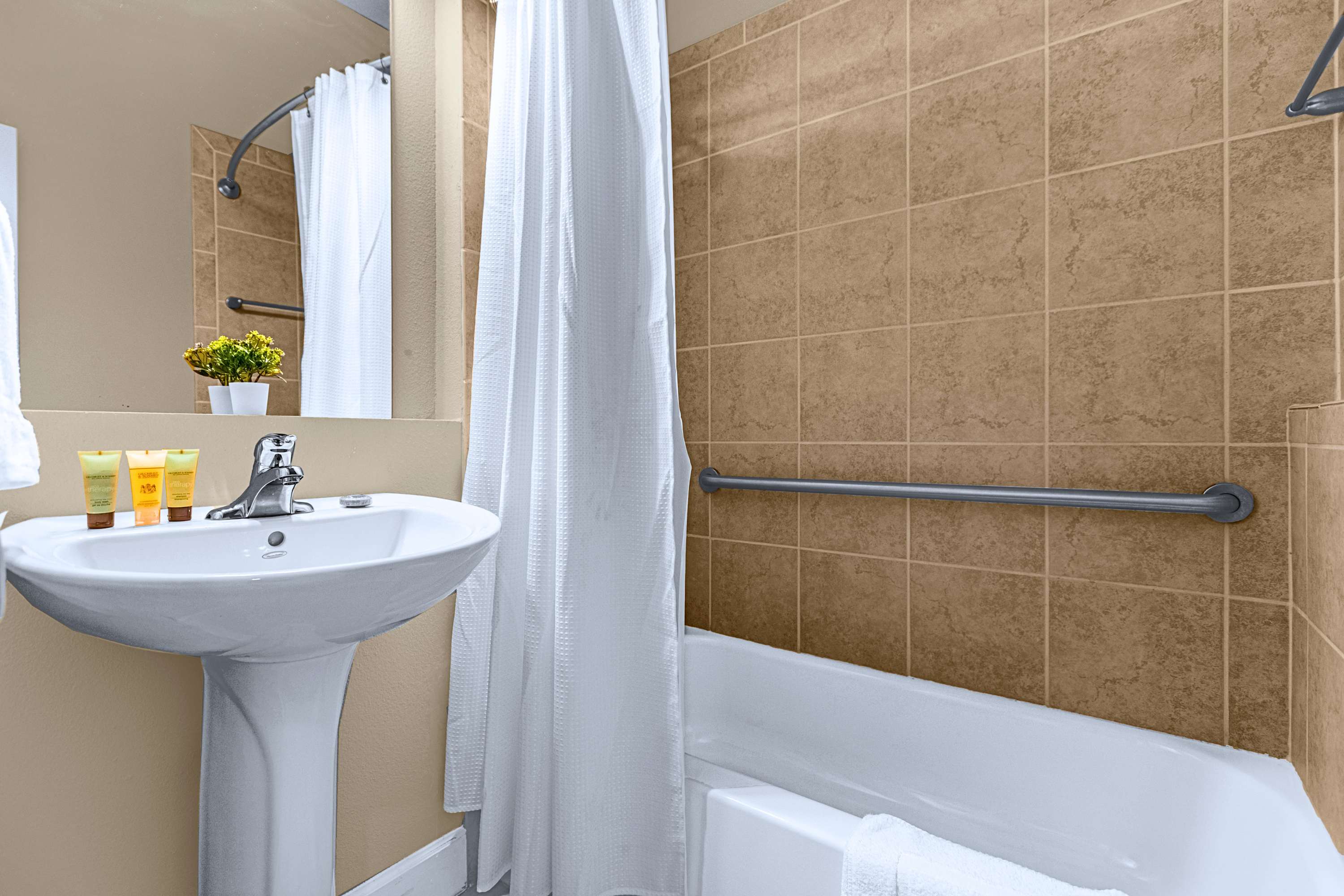 A well-appointed bathroom equipped with modern fixtures and crisp towels