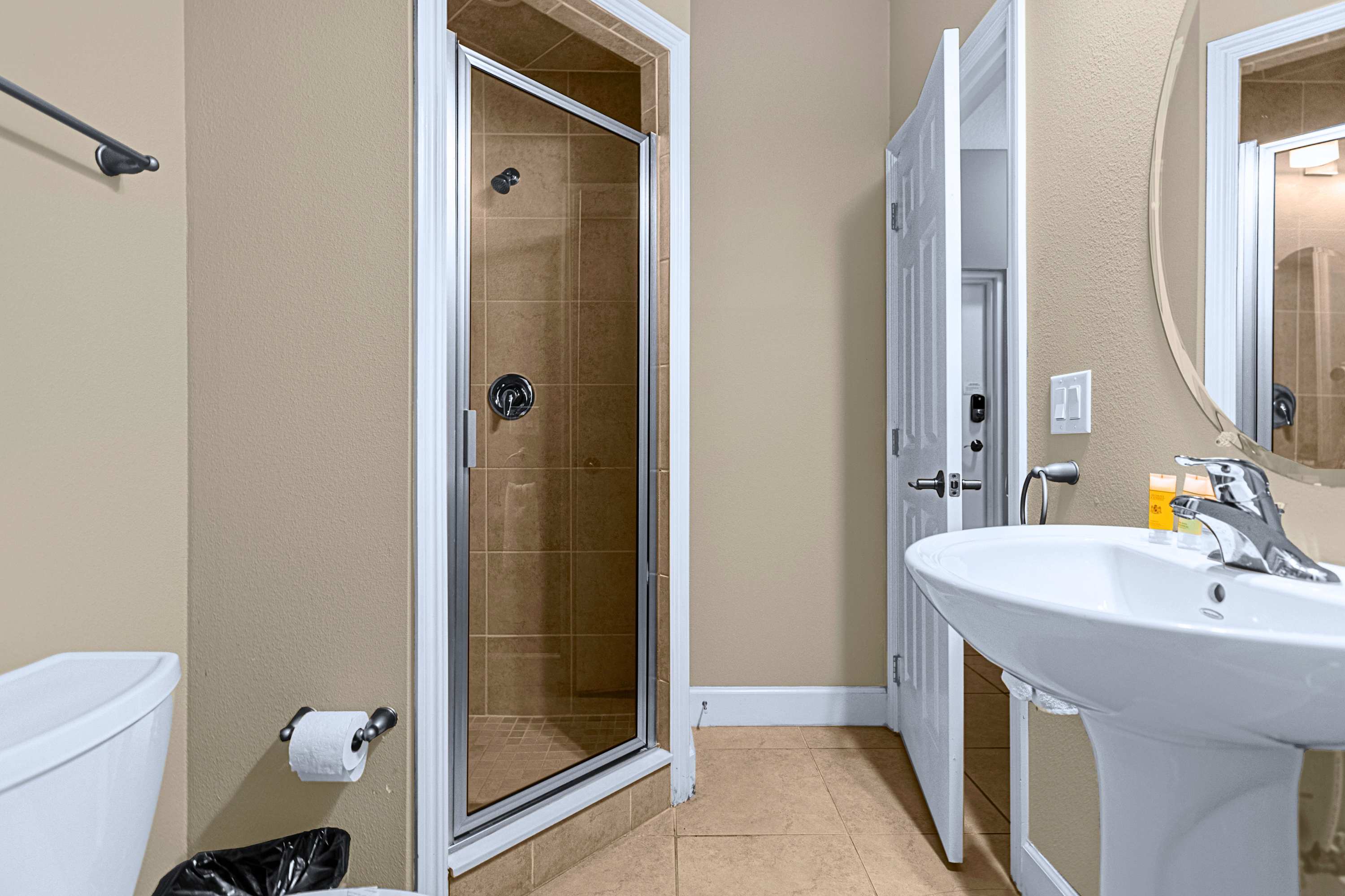 Modern bathroom setup featuring updated fixtures and generous counter space
