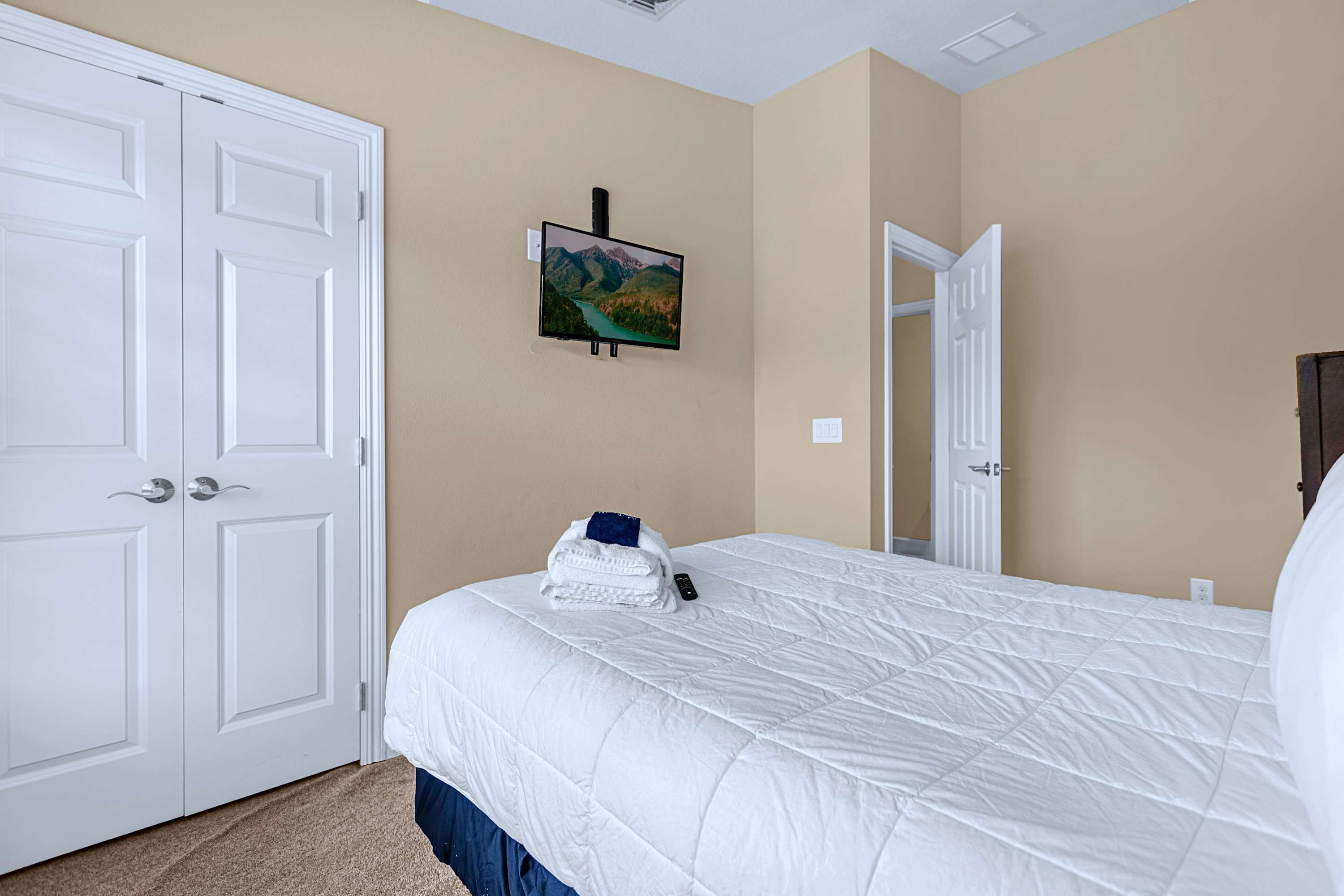 A restful bedroom layout framed by simple decor and neutral wall tones