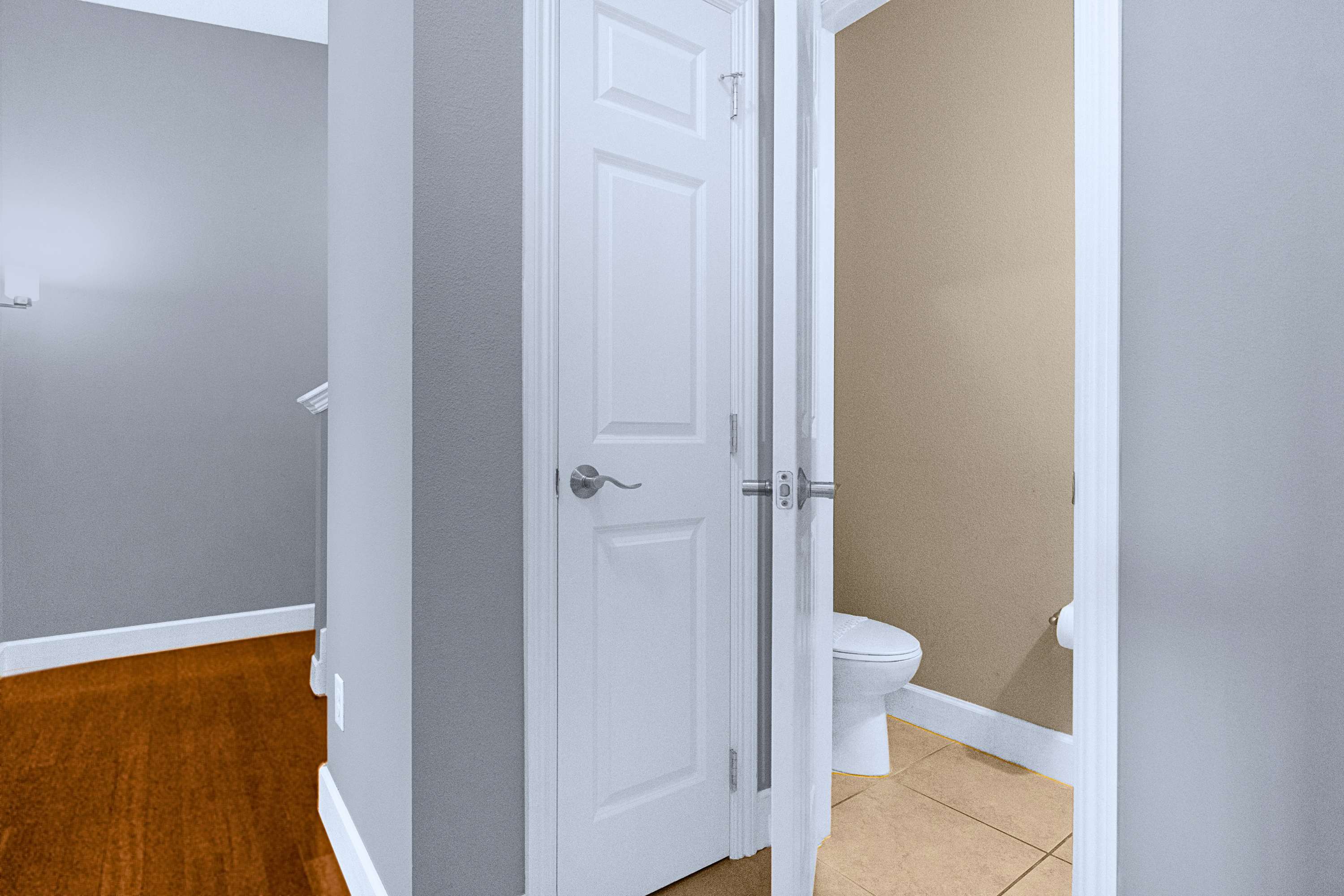 A clean interior hallway leading upstairs to private bedroom quarters