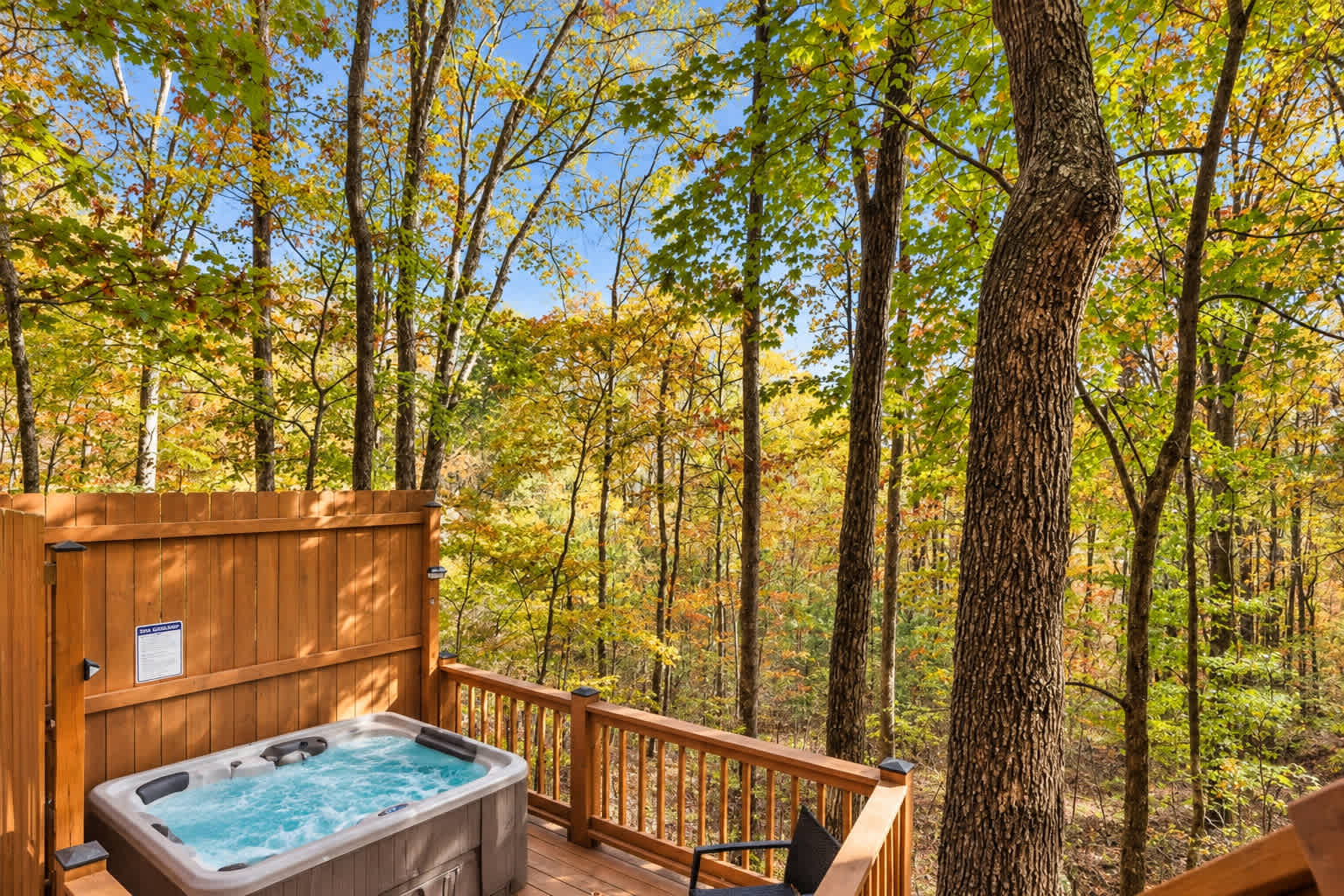 Welcome to Grady's Hideaway! Your hot tub deck framed by the trees