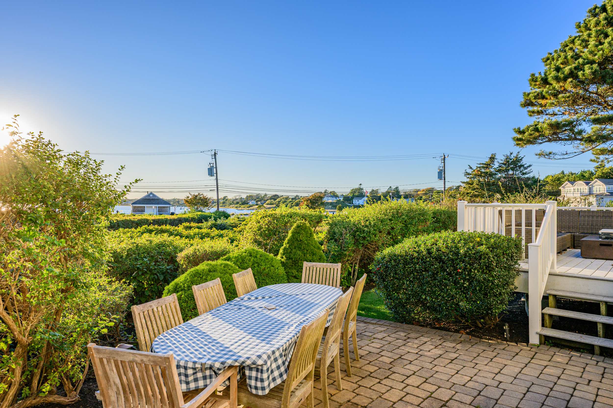 Gather with family and friends on the spacious deck, featuring comfortable outdoor seating and beautiful water views.