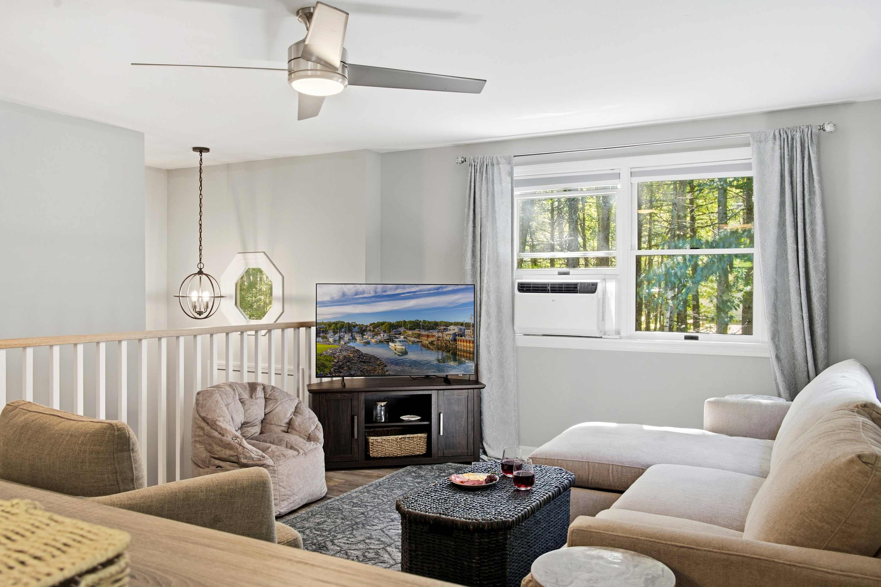 Settle in and make yourself at home in the living room with a Smart TV and full sleeper sofa