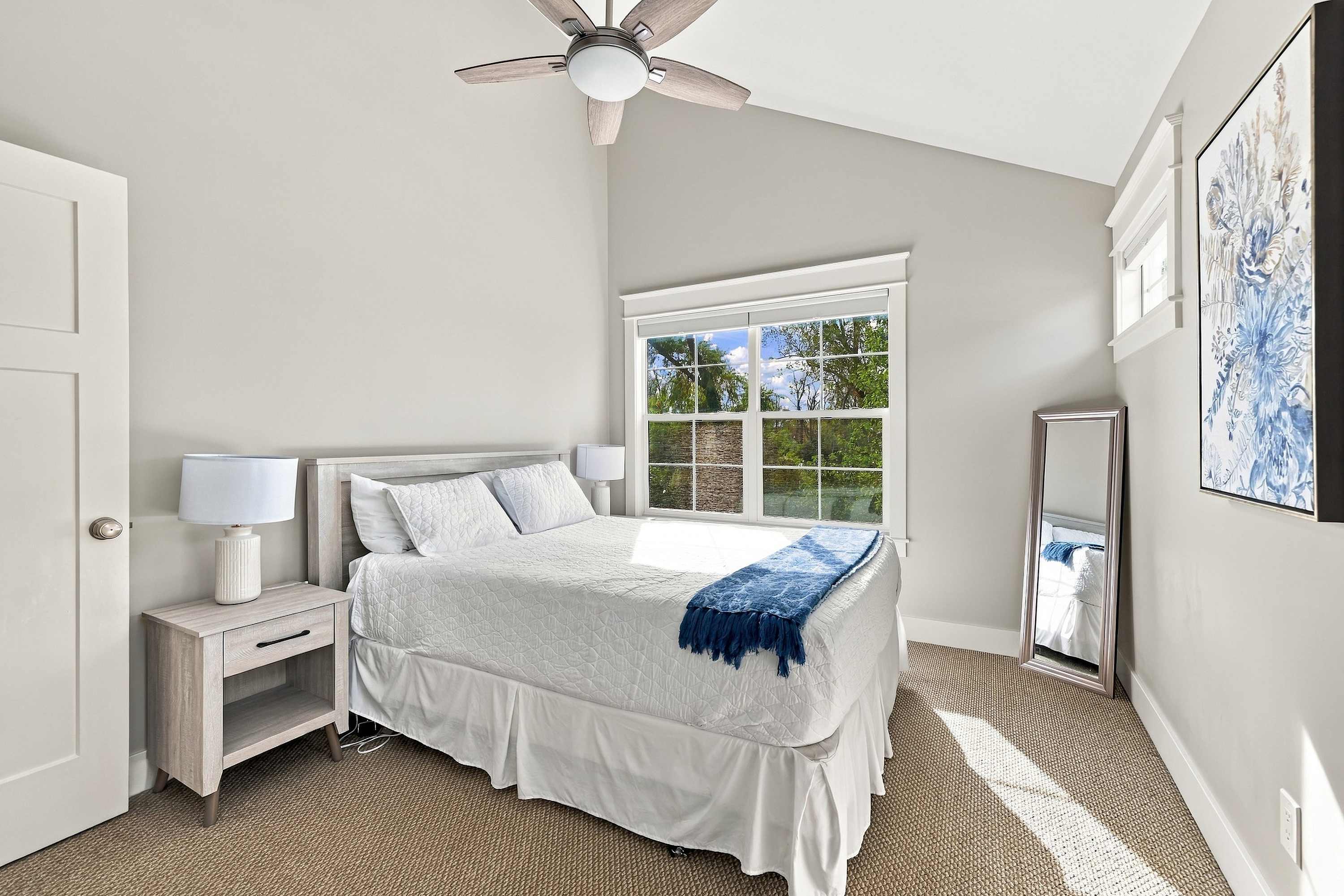 Bedroom 3 is on the 3rd level with a queen-sized bed.