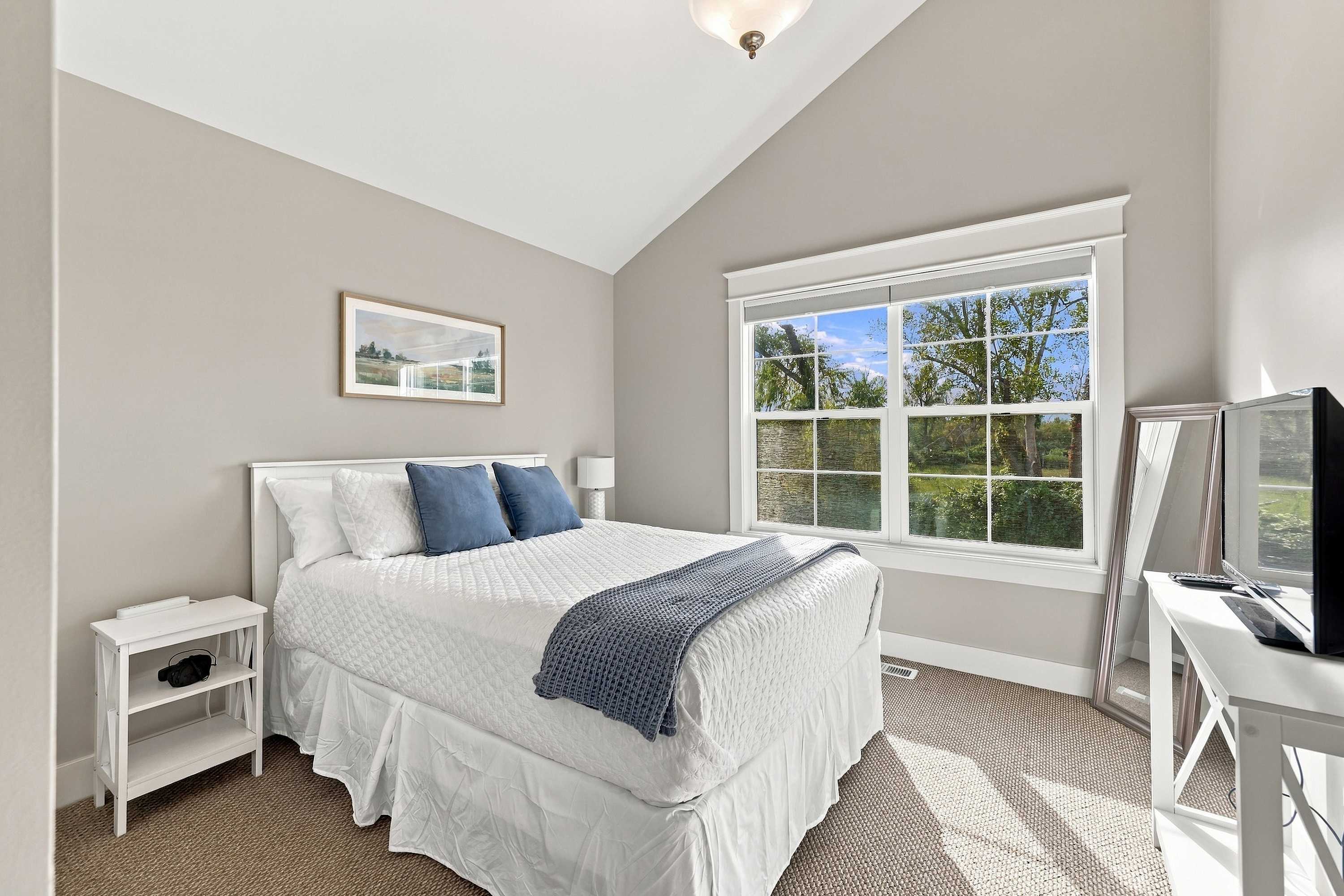 Bedroom 2 is on the 3rd level and has a queen-sized bed.