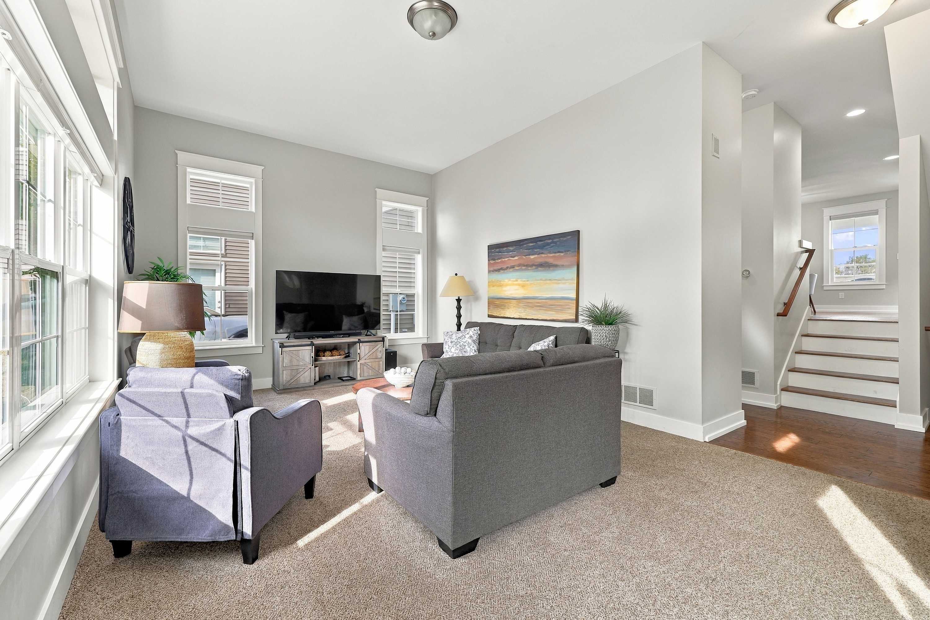Afternoon sun pours across the lounge in this Benton Harbor vacation home.