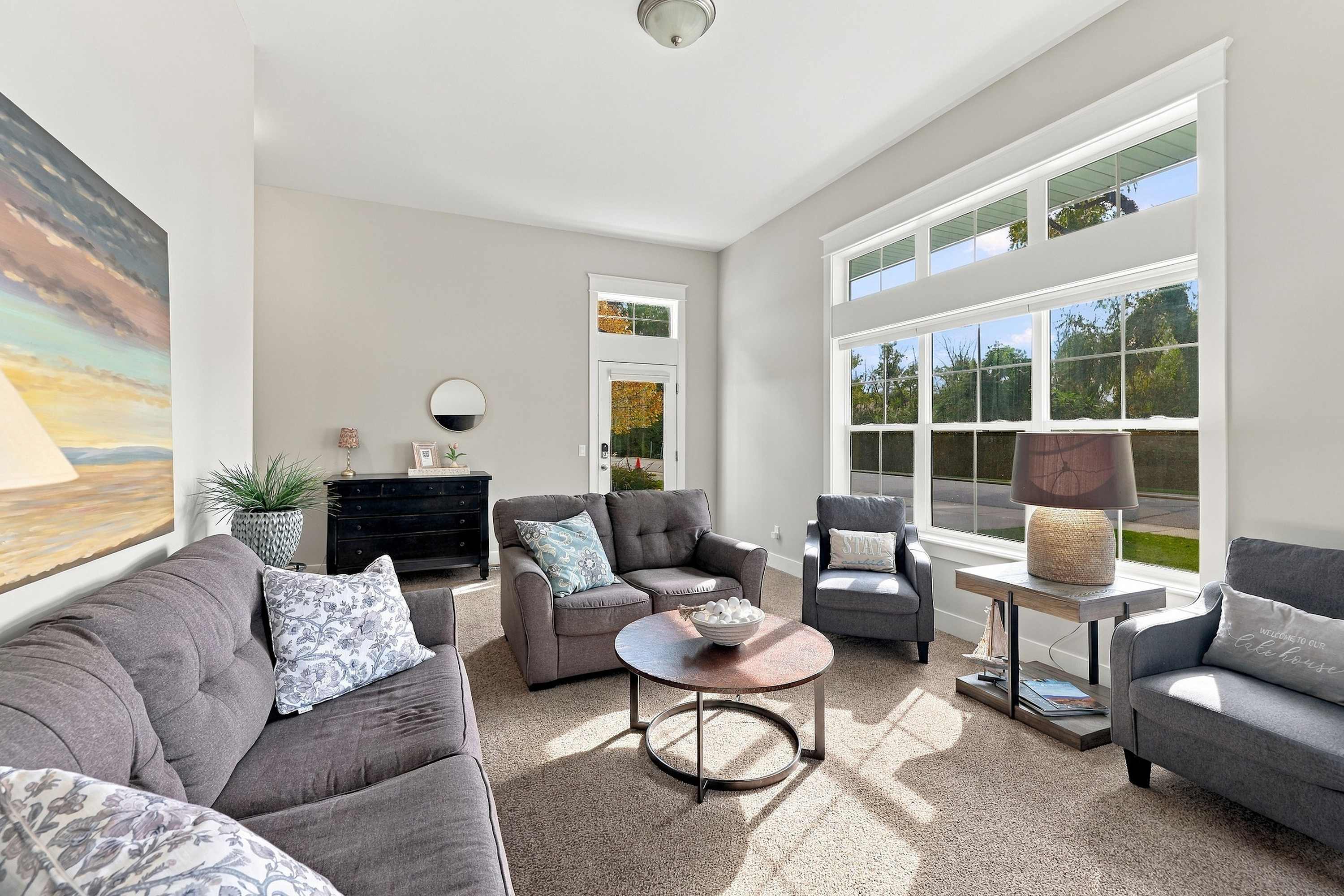 Keyless entry opens straight into the sunlit Benton Harbor living room.