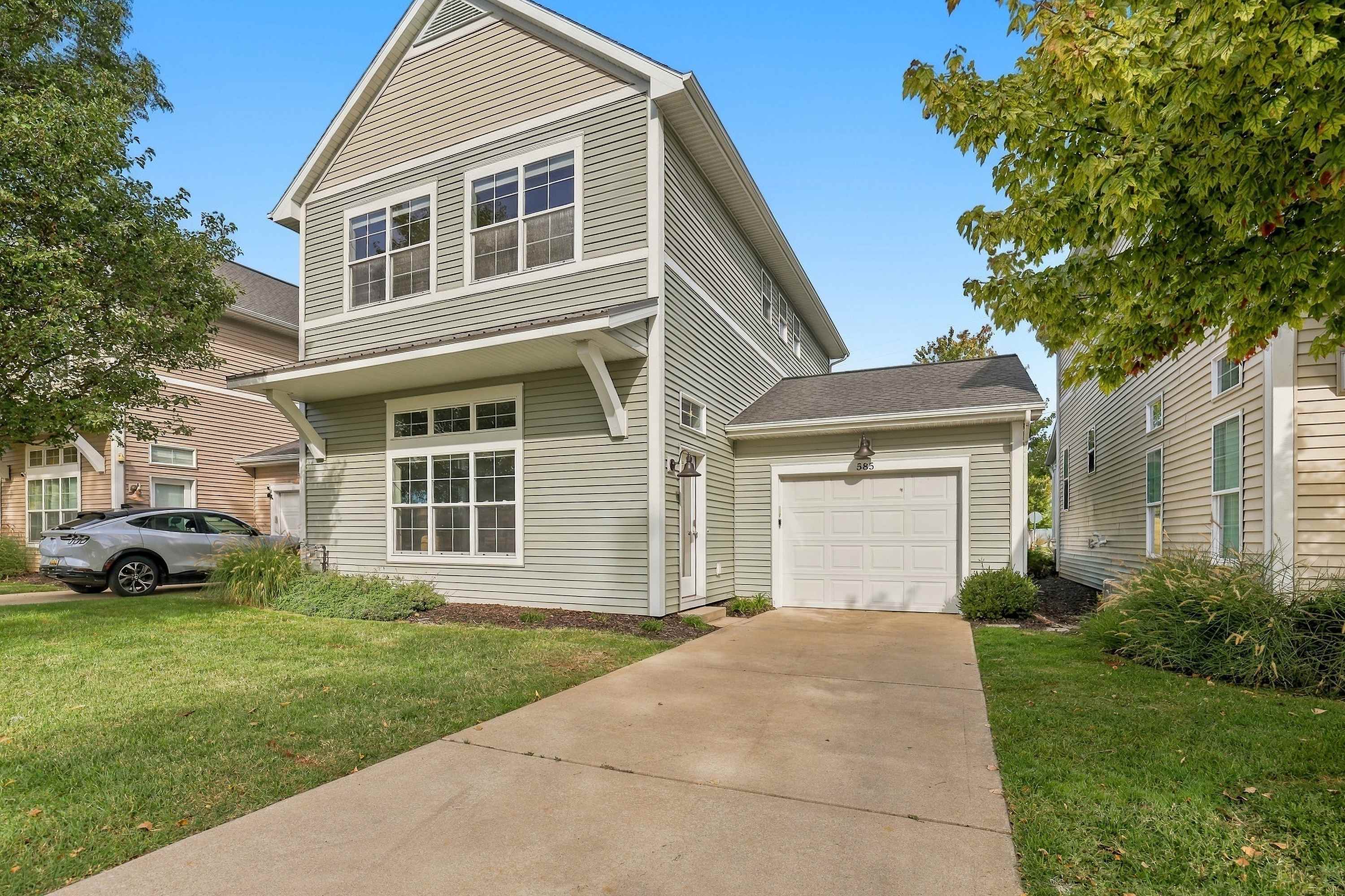 An attached garage and private driveway make arrival easy in Benton Harbor.