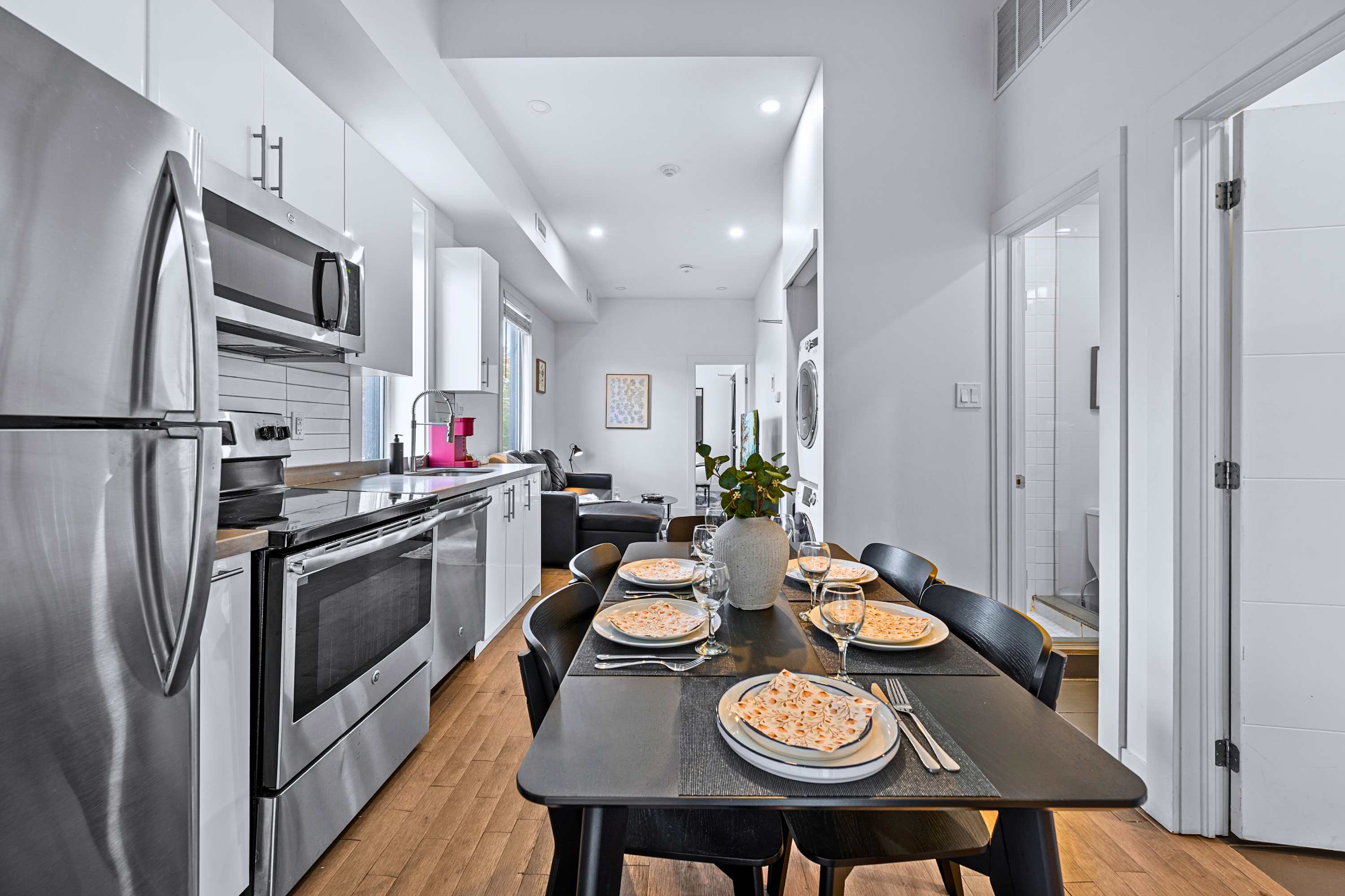 Seamless open-concept layout connecting the kitchen area to the dining space