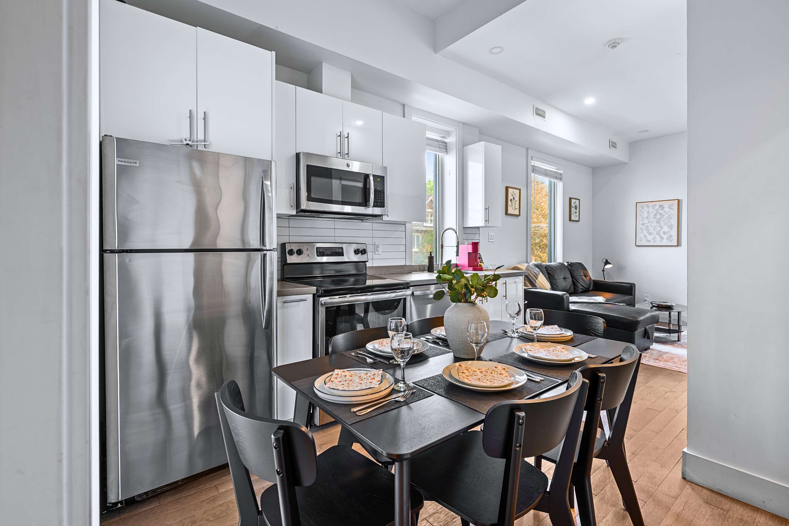 A modern, fully equipped kitchen featuring stainless steel appliances