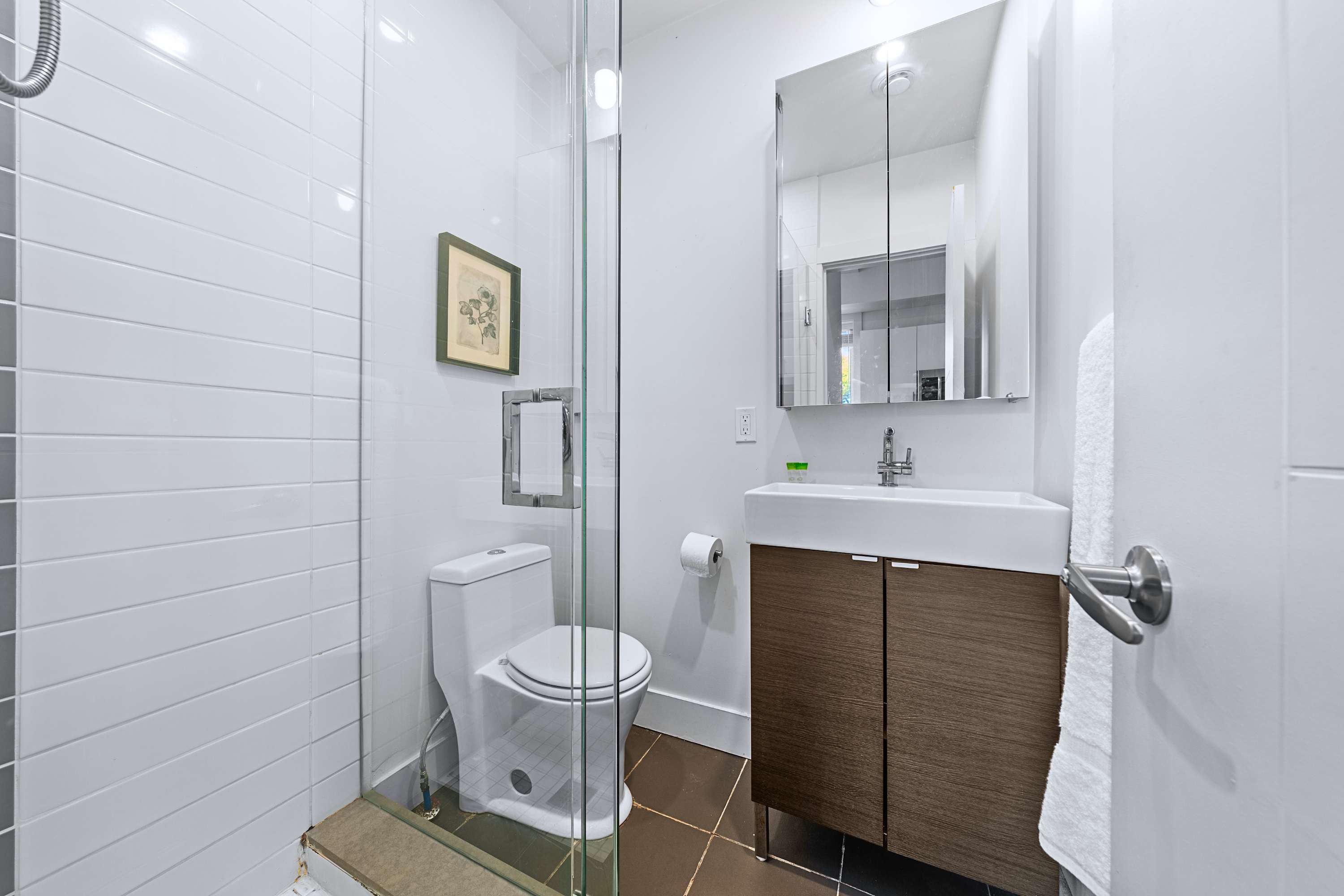 Modern bathroom setup featuring updated fixtures and generous counter space