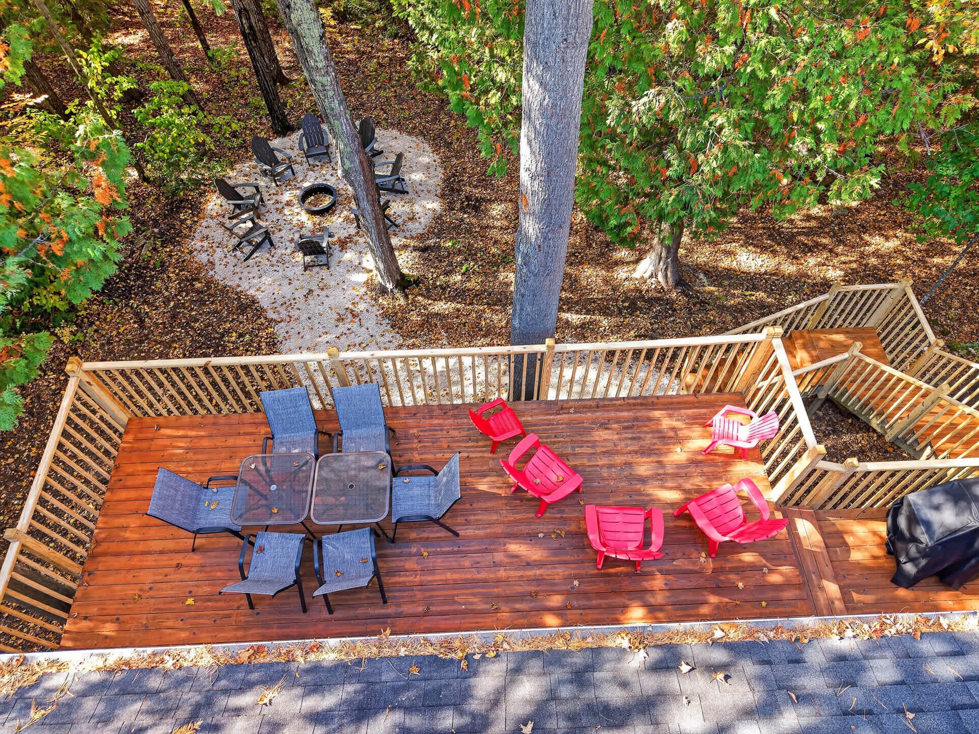 Fire pit with seating for 8, deck with patio furniture, and propane grill - ready for a Door County evening outside.