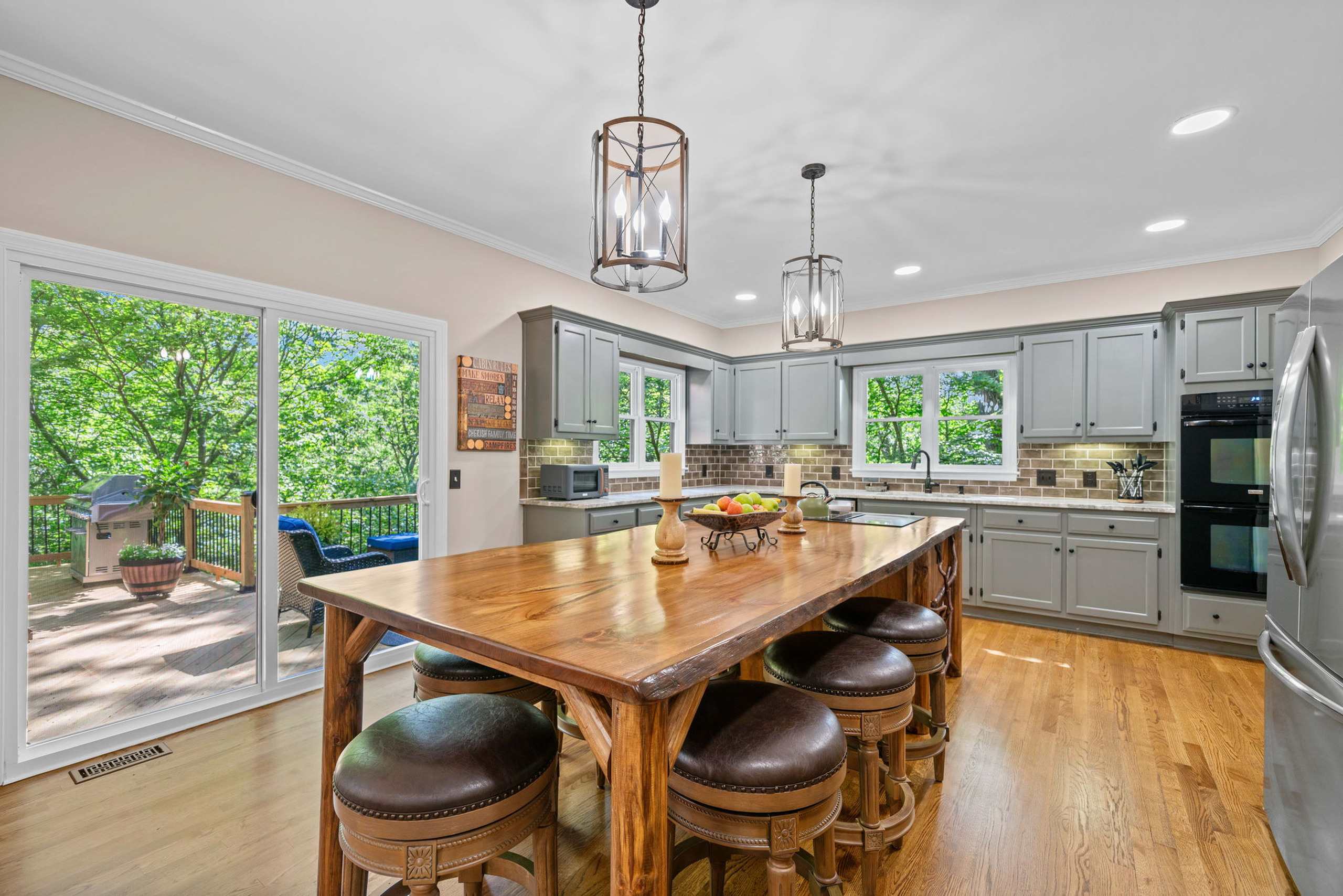 Cook, dine, and connect in the open kitchen with a dining island that seats 7​