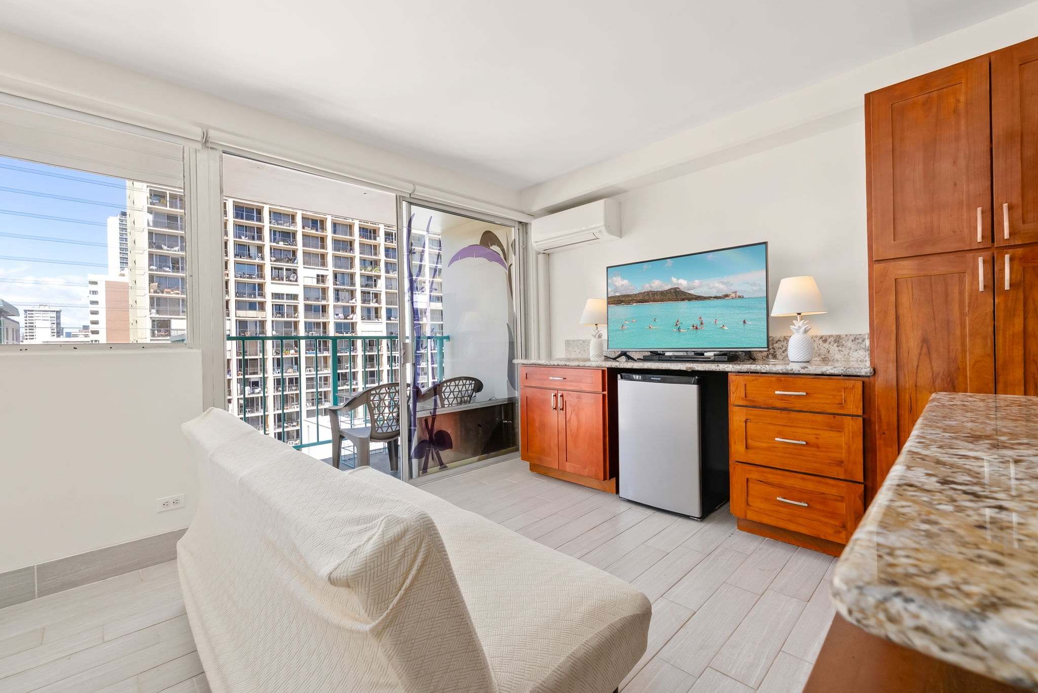 Relax in the studio with a cozy couch, Smart TV, and access to your private balcony