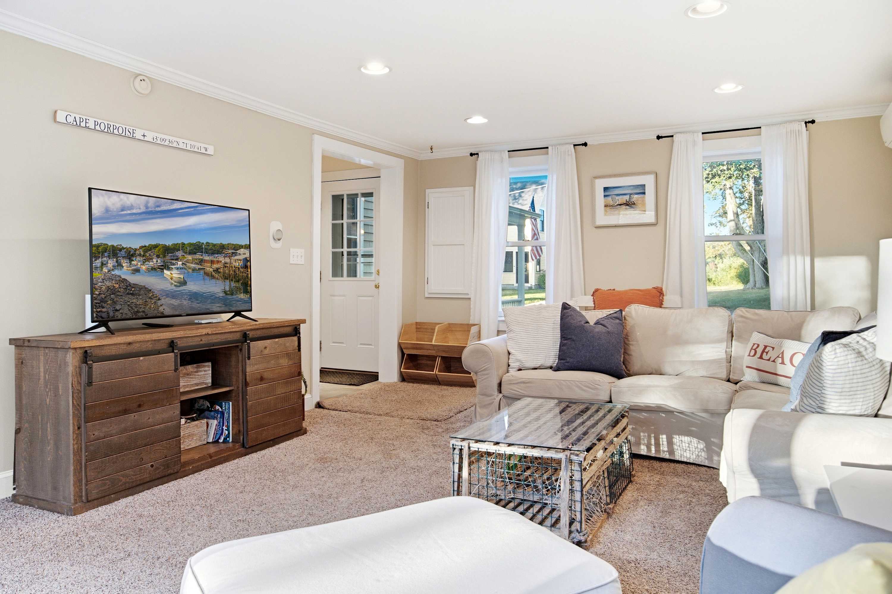 A welcoming living room with comfortable couches and a Smart TV for your entertainment
