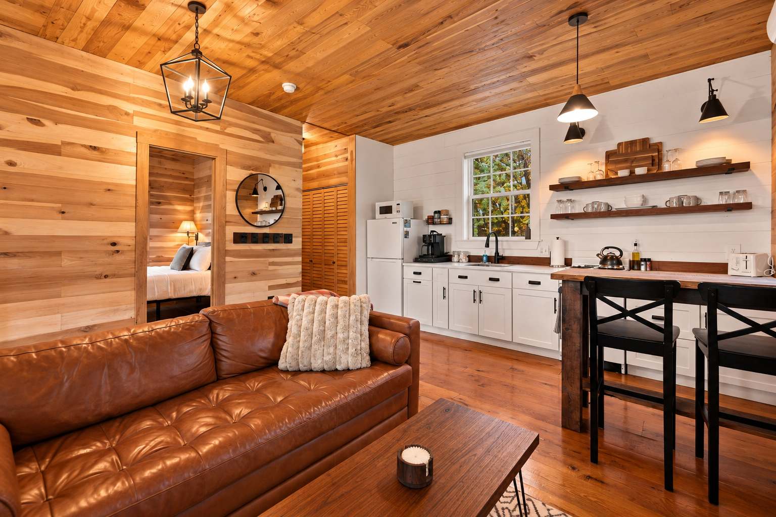 Enjoy a cozy living area, fully equipped kitchen, comfortable bedroom, and outdoor spaces for gathering and unwinding.