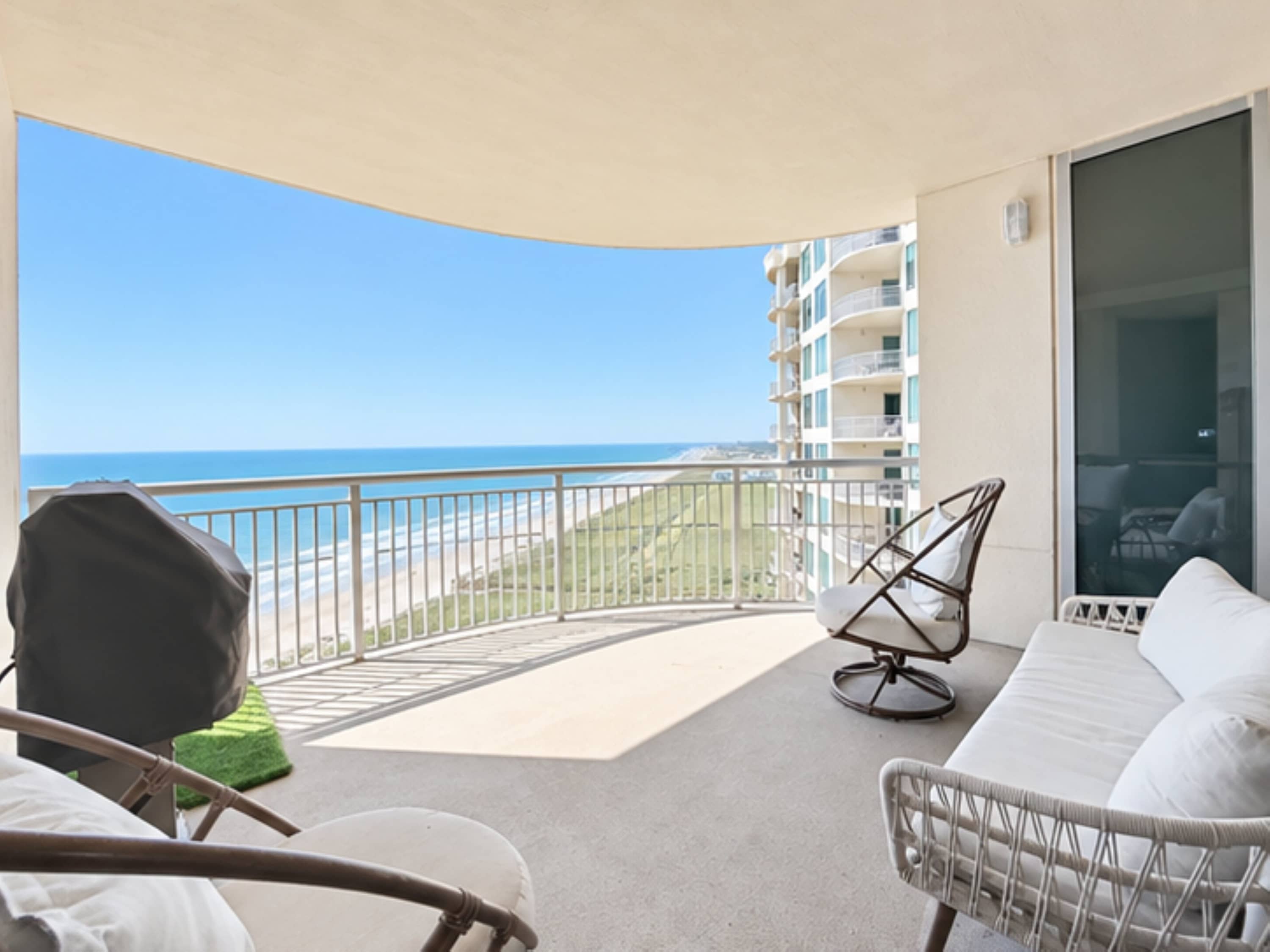 Relax in the covered outdoor seating area while taking in the beach and ocean views, with a BBQ grill for easy outdoor cooking