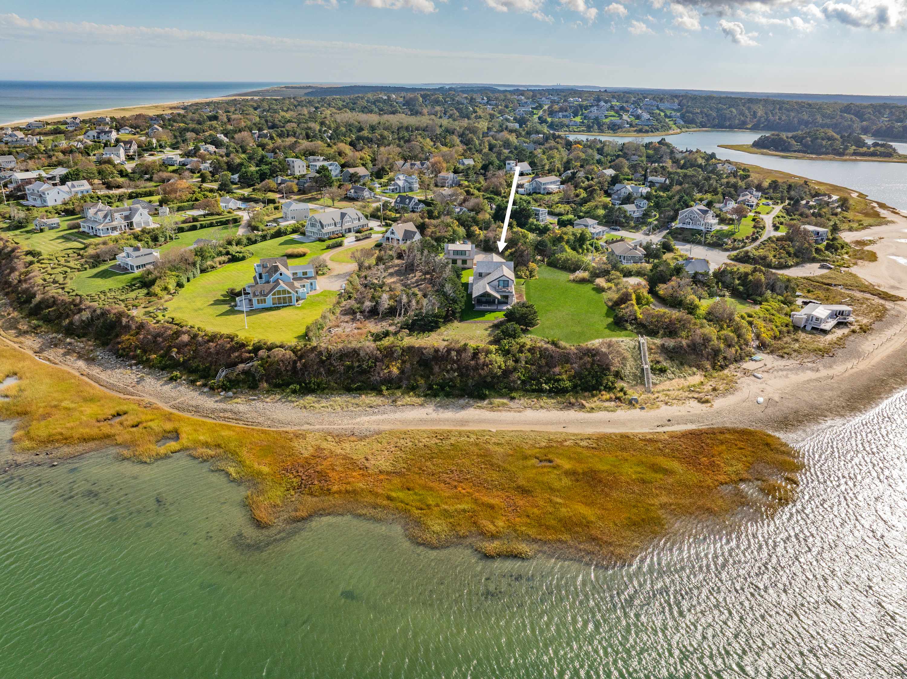 This beautiful newly built home comes with a stairway to a private beach. 