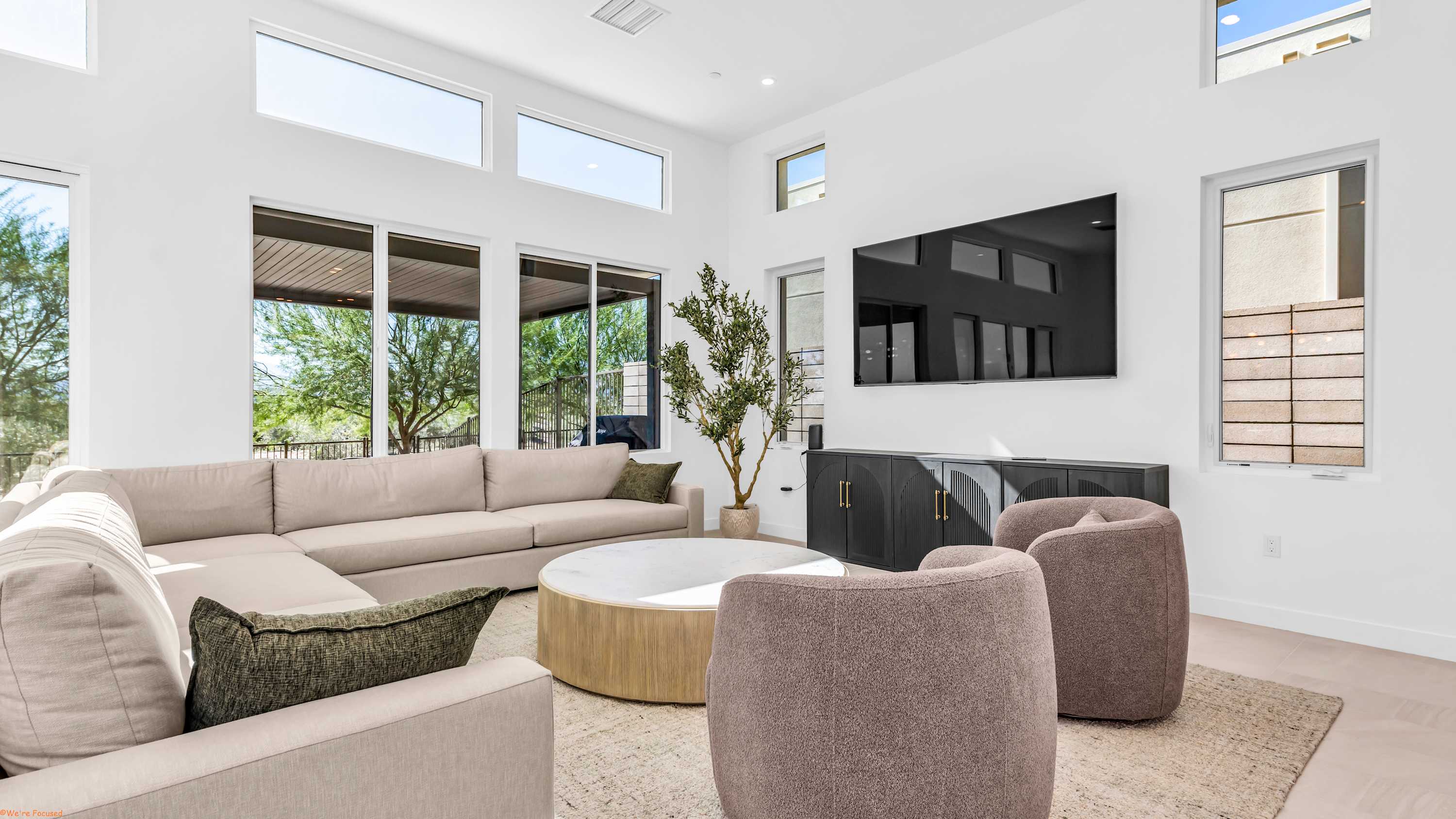 Unwind in the airy living room & stream your favorites on the smart TV​