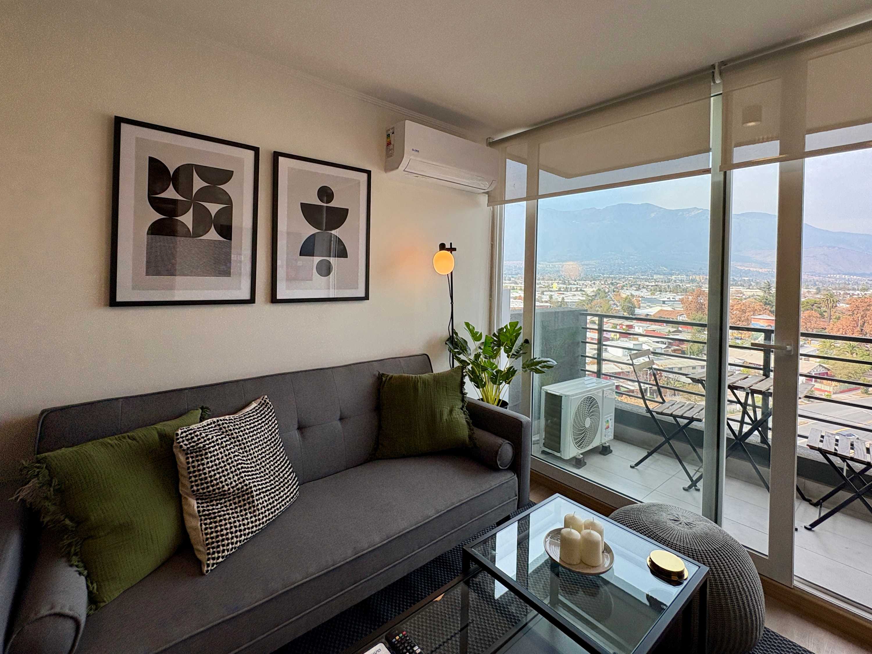 Bright living room with city and mountain views