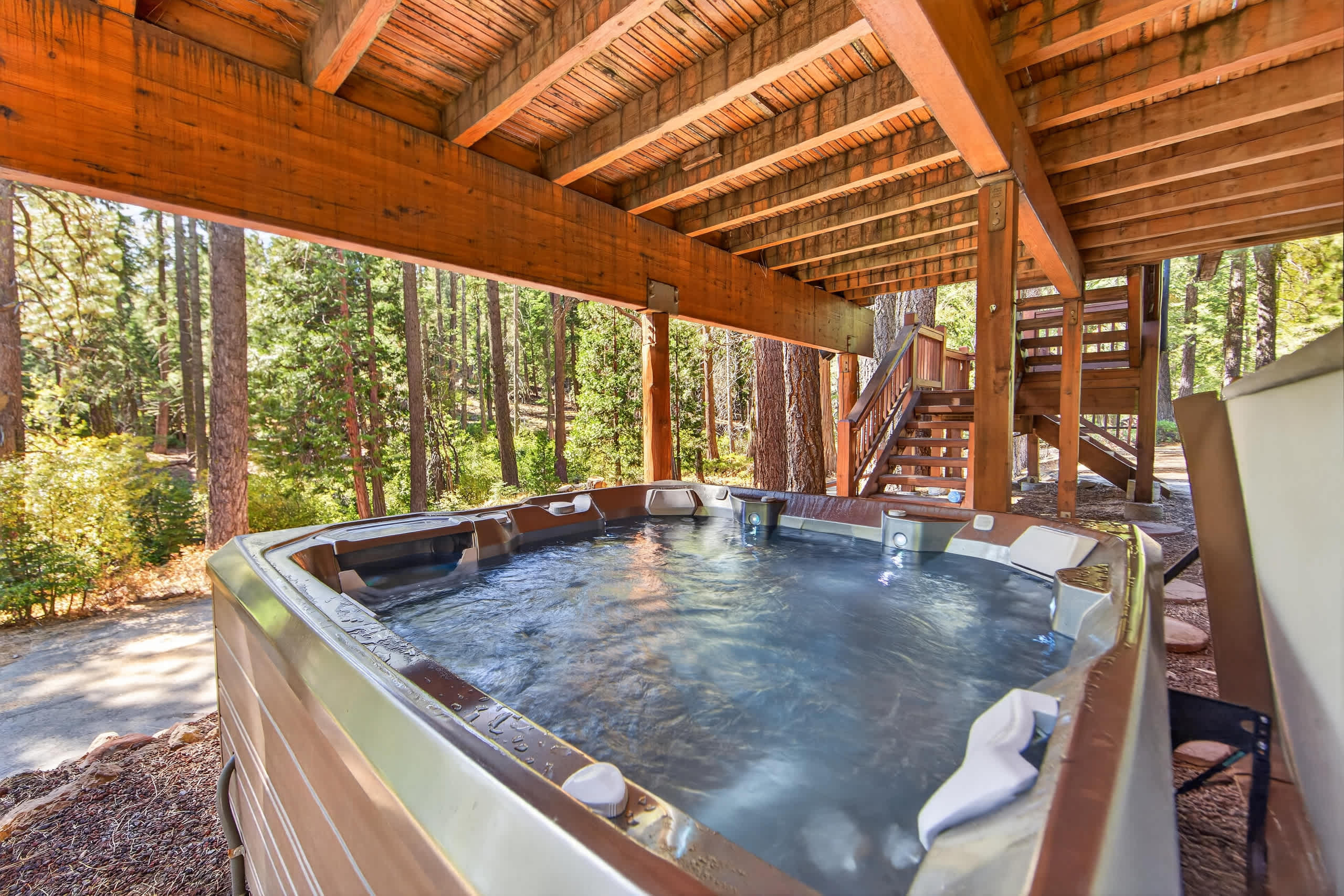 Soak away the day in the hot tub tucked beneath the deck, surrounded by the peaceful mountain atmosphere​