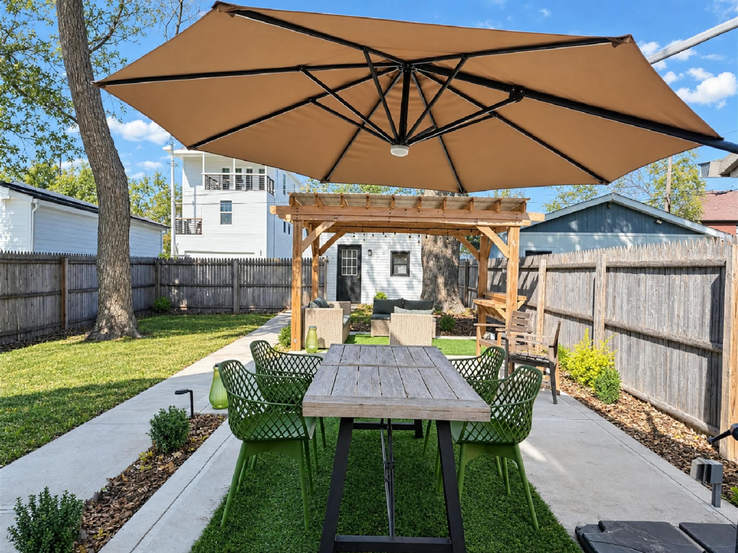 Lounge the day away or dine alfresco in the back yard​
