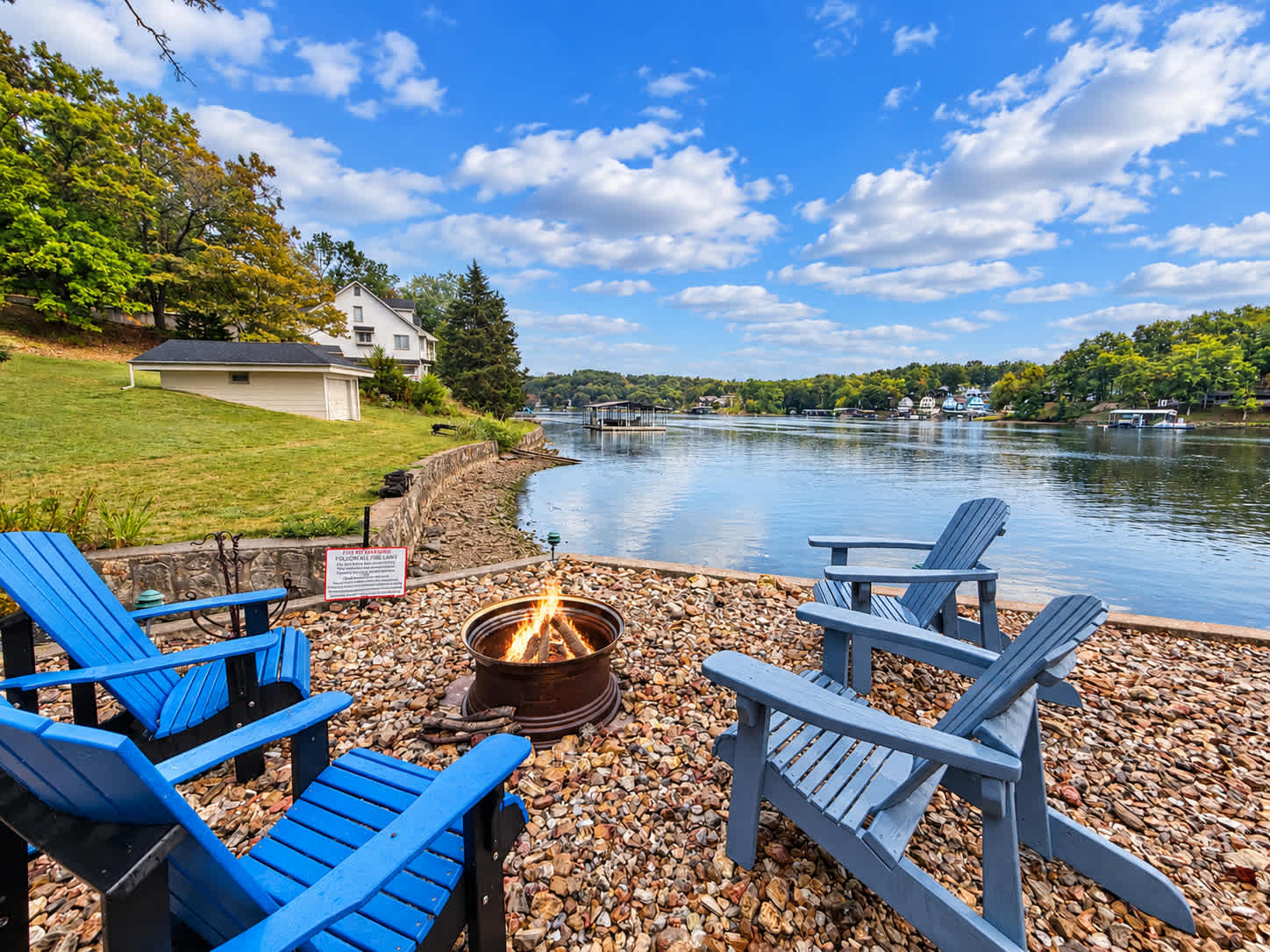 Roast marshmallows, share stories, and unwind by the lake at the fire pit with seating for 4​