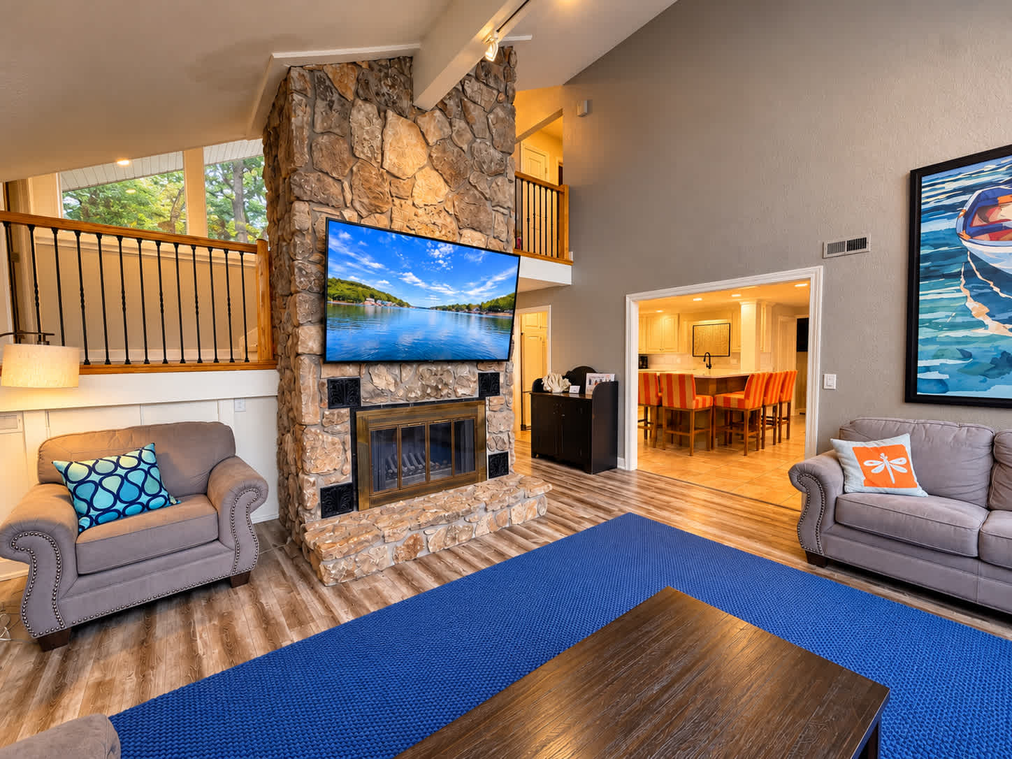 Relax on the comfortable couches and enjoy your favorite shows with beautiful lake views just beyond the living room​
