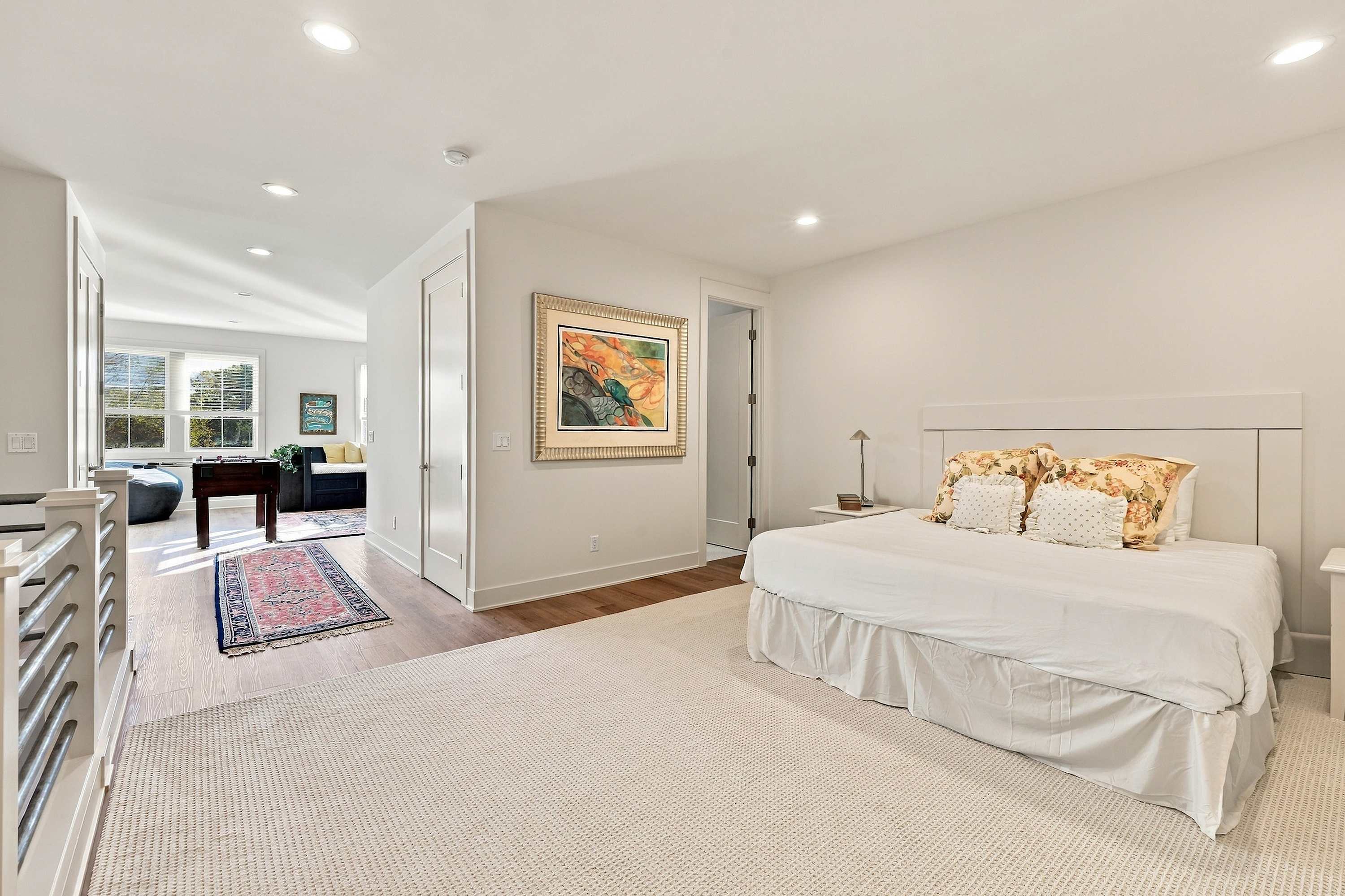 Family room is on the upper level and has a king-sized bed, a single bunk bed, and a daybed.