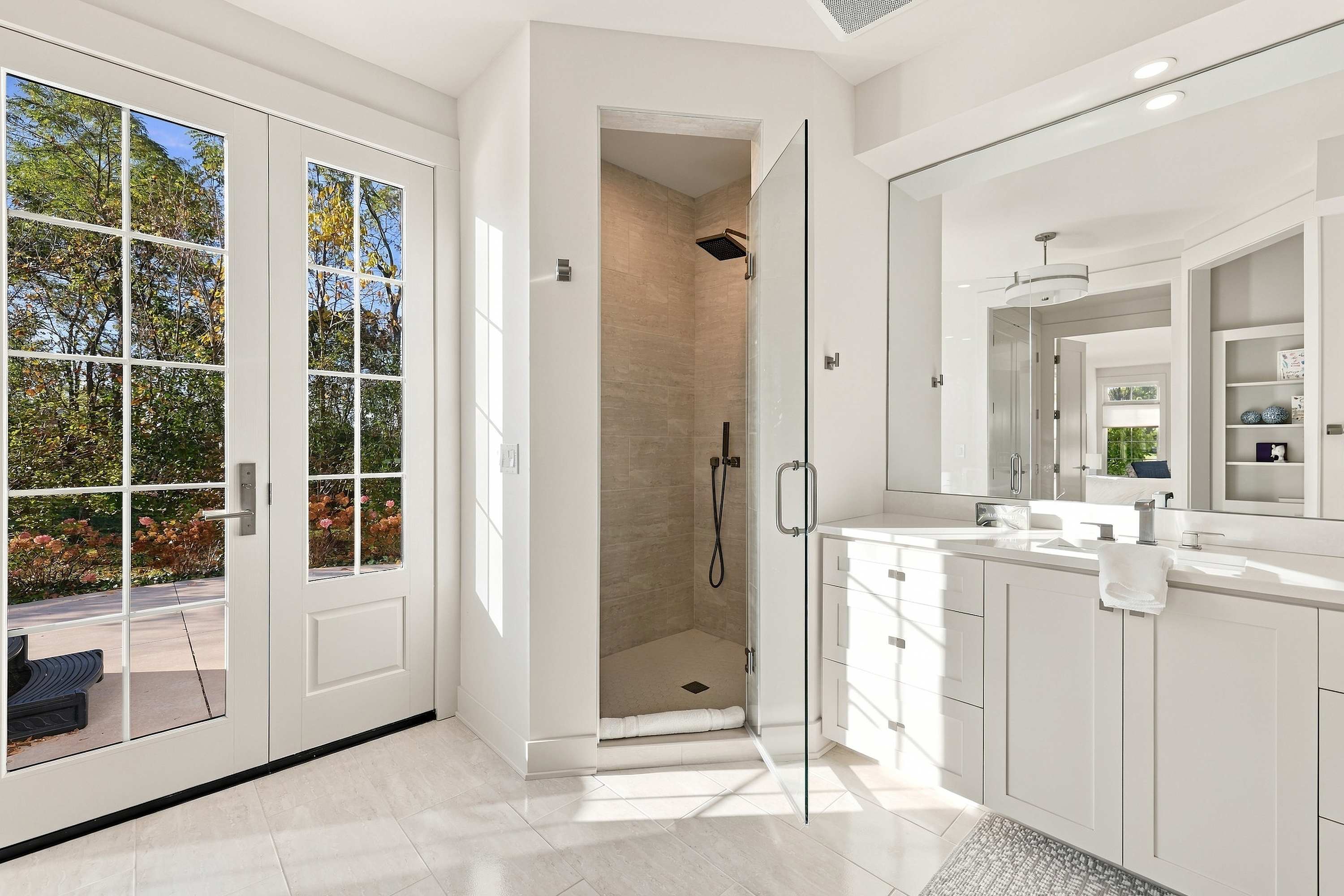 Master ensuite with a rain shower and doors to the hot tub.