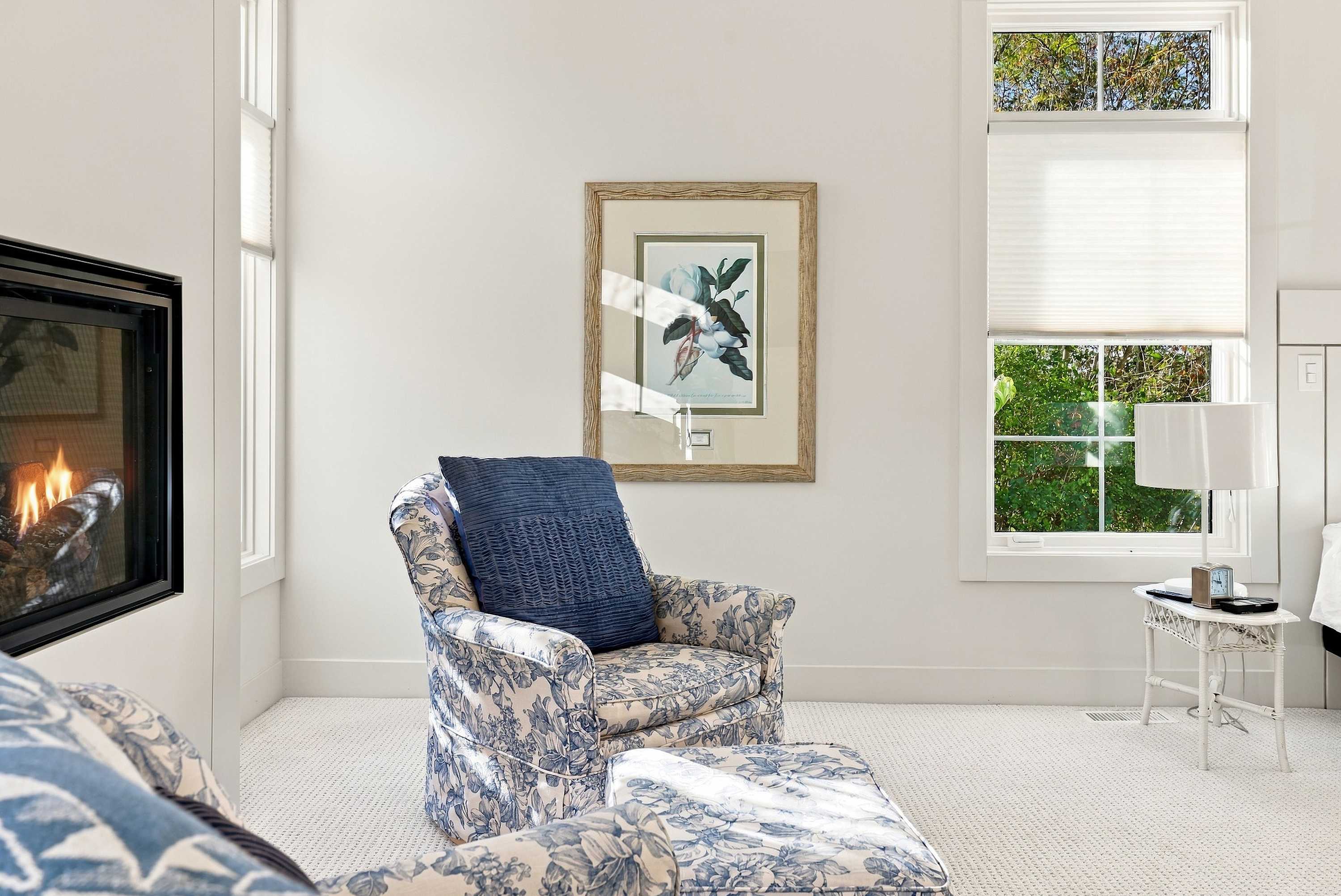 A quiet corner of the master bedroom, warmed by its own fireplace.