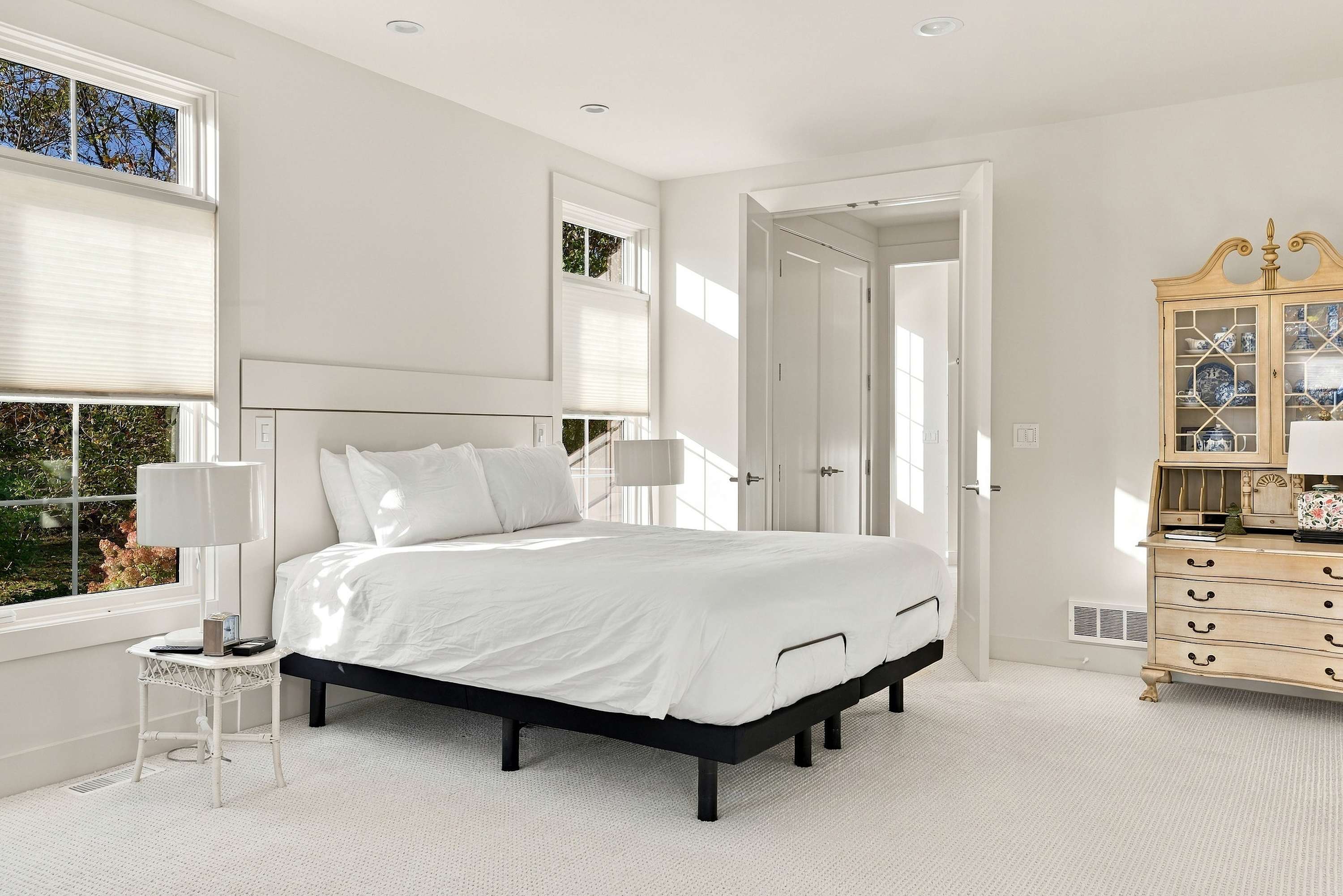 Harbor Country bedroom with a split king adjustable bed and double doors.