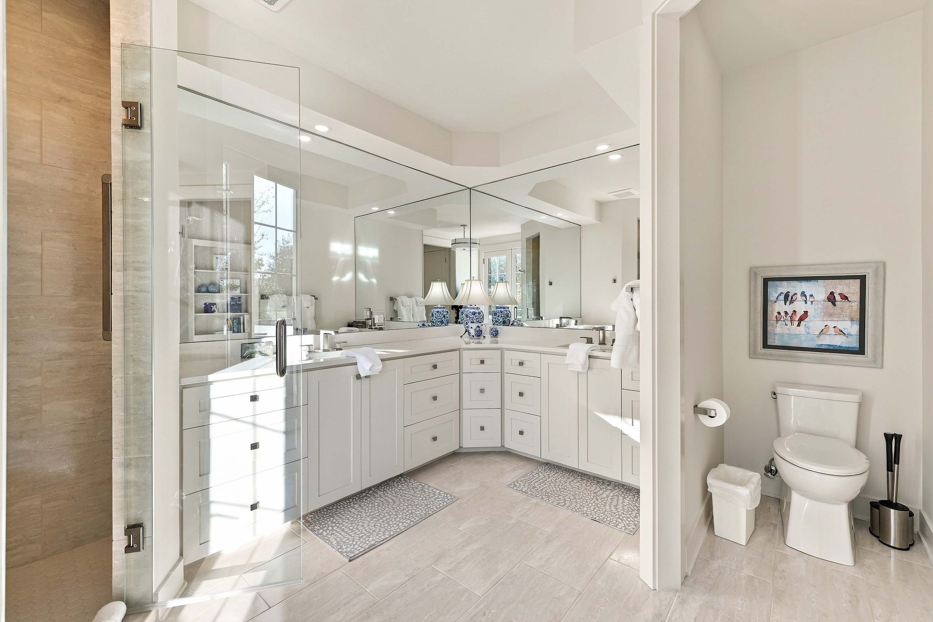 Master ensuite with a double vanity and frameless glass shower.