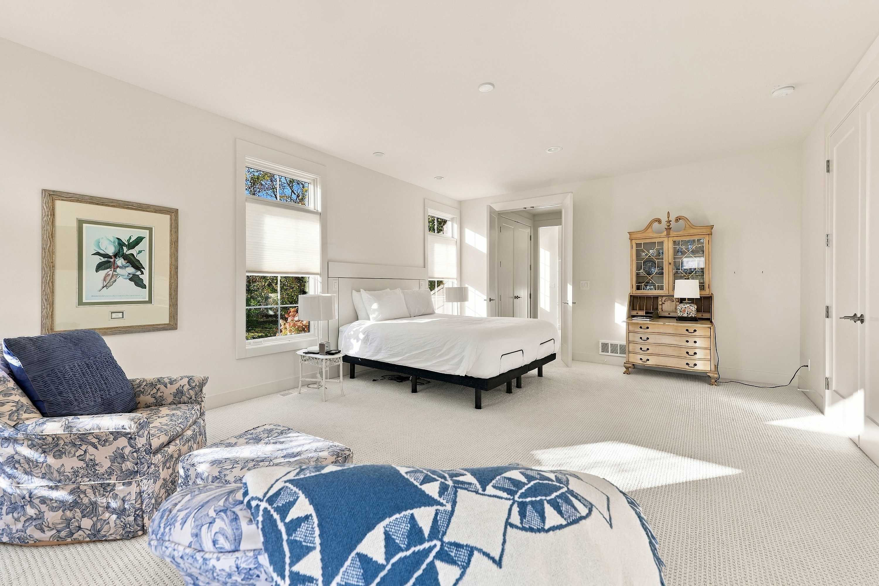 Master bedroom is on the main level and has a king-sized bed and an ensuite.