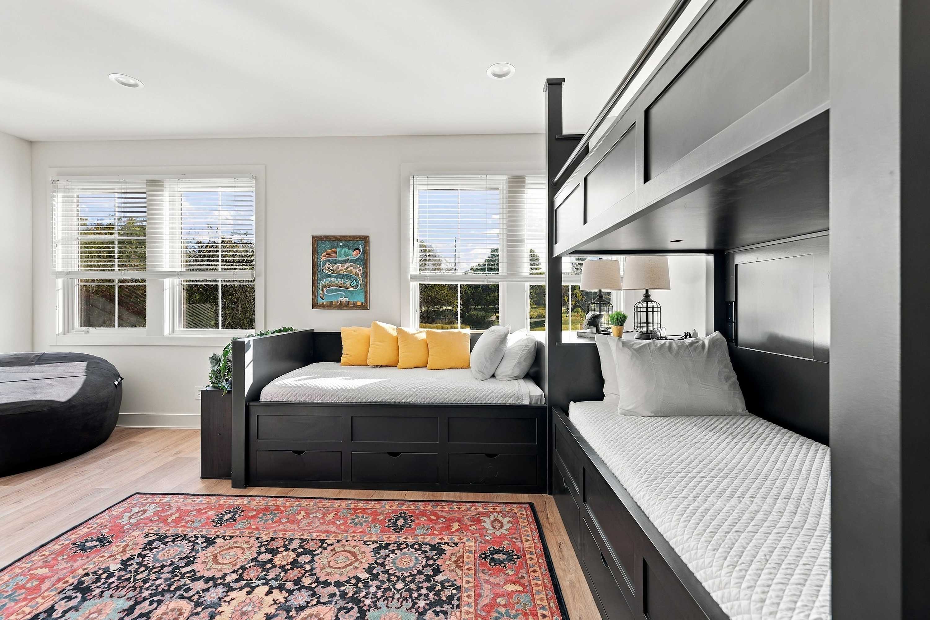 Bunk area with a sunny window daybed for an extra sleeper.