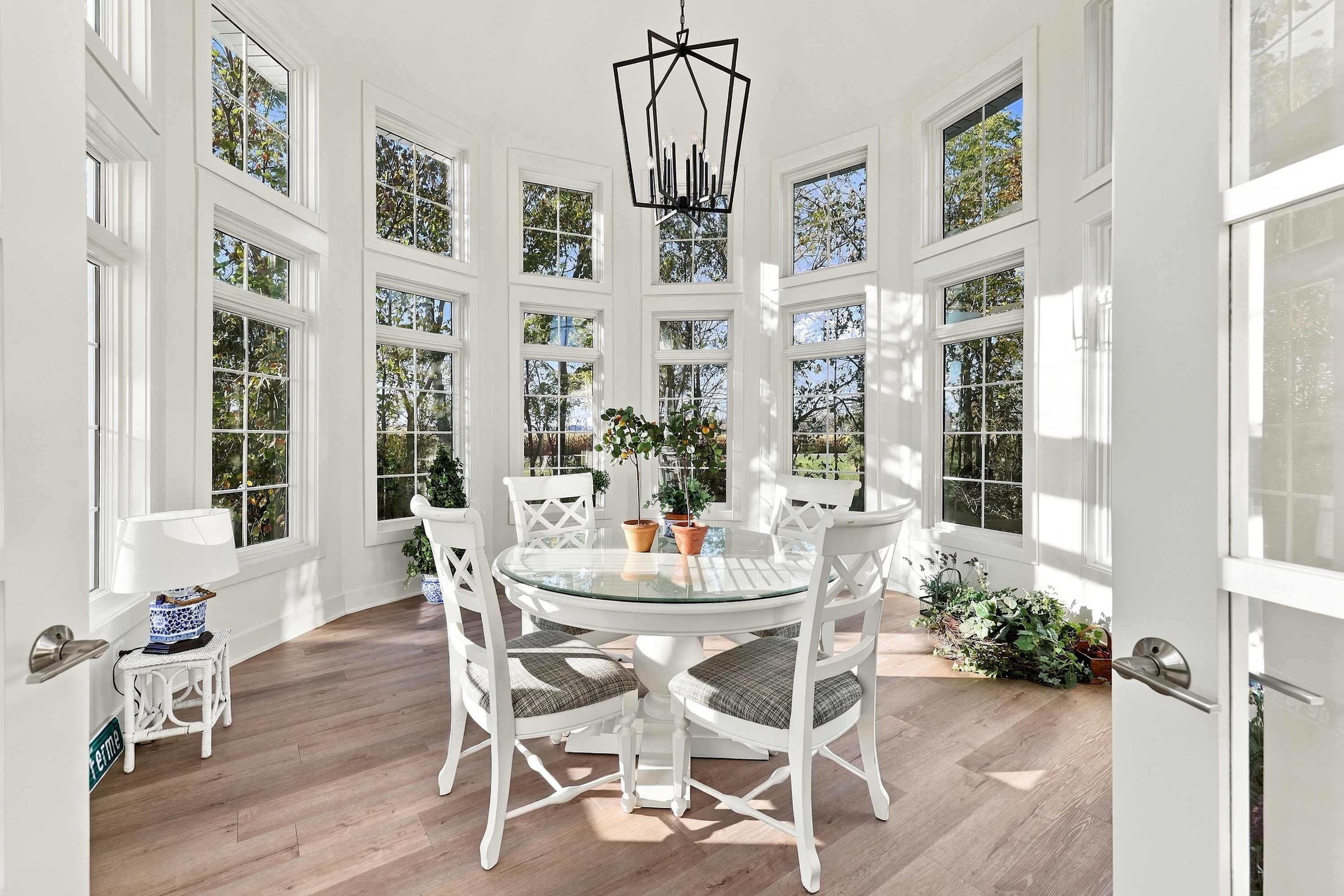 French doors open to a round table in The Barn’s sunlit turret.