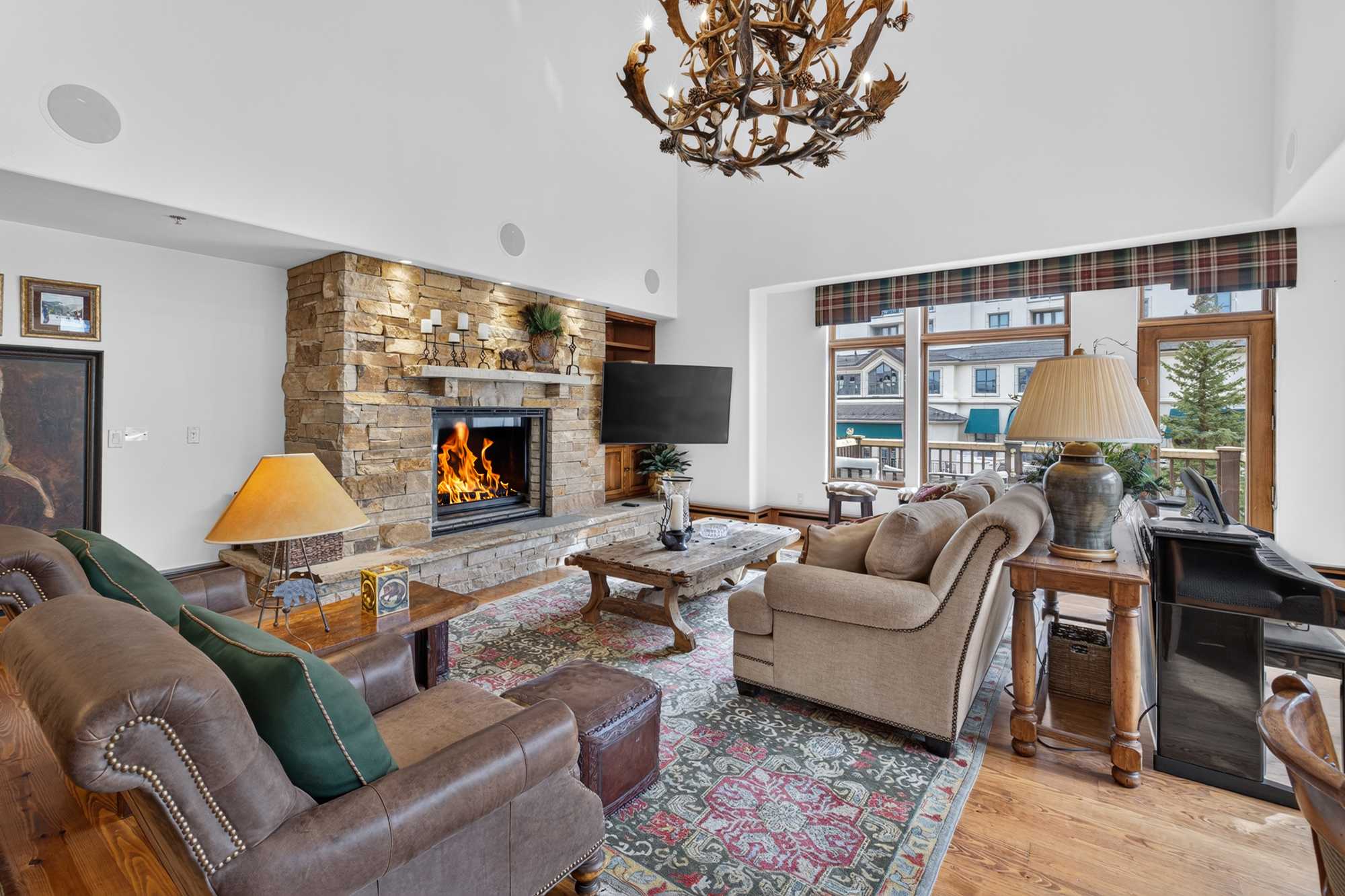 Unwind after a day of mountain adventures with plush seating, a crackling gas fireplace, and your favorite shows on the Smart TV​