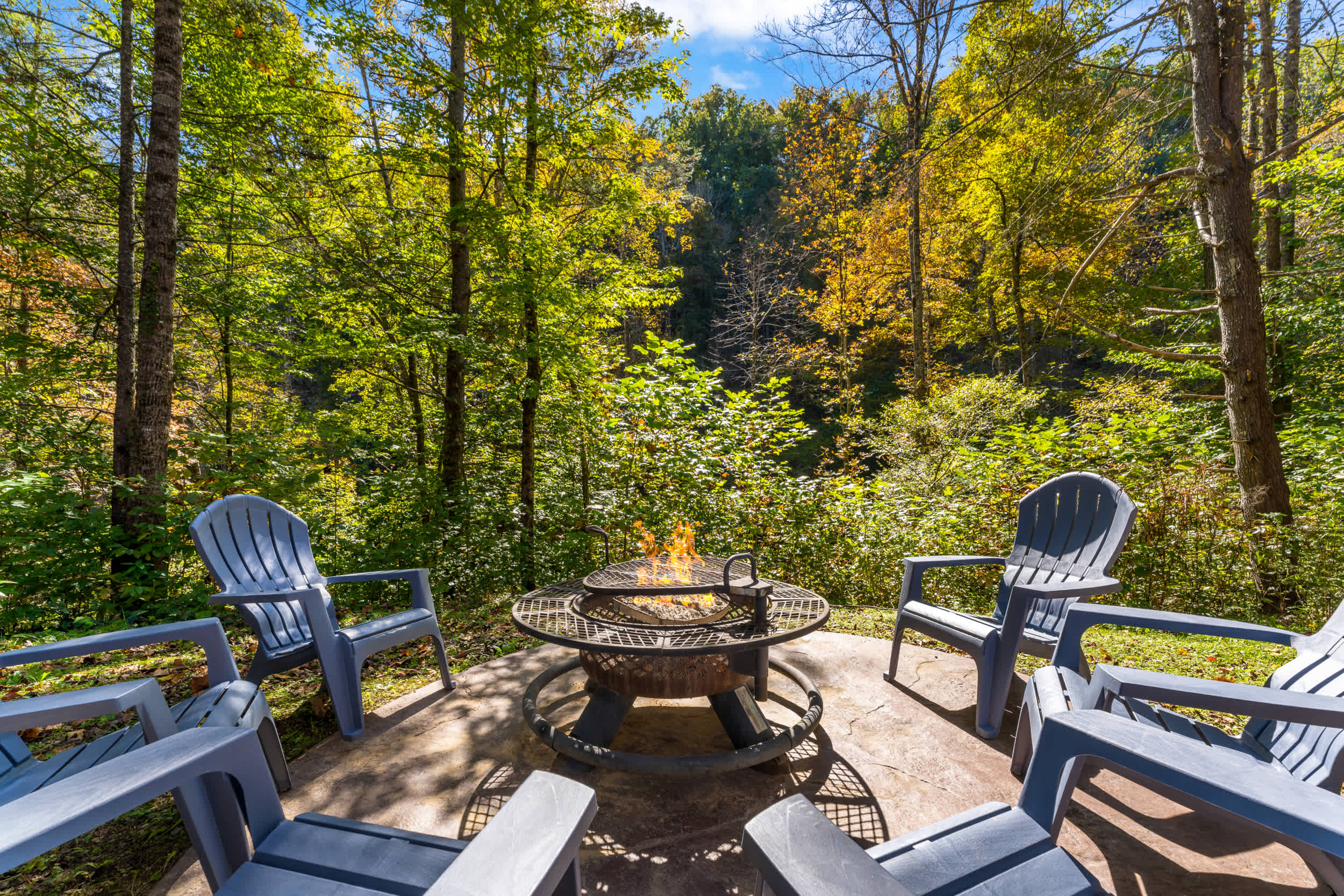 Soak in the outdoor hot tub or gather around the backyard fire pit surrounded by wooded nature.