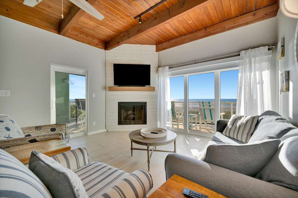 Bright living room with vaulted wood ceiling