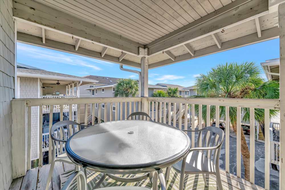 Covered balcony table for breezy outdoor dining