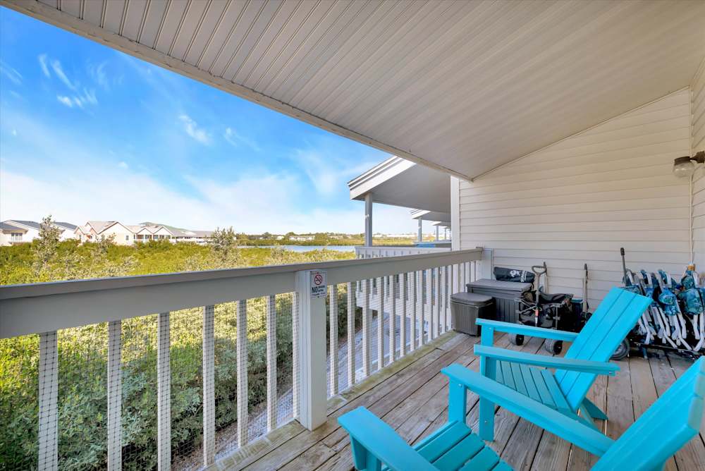 Furnished balcony with Adirondack chairs