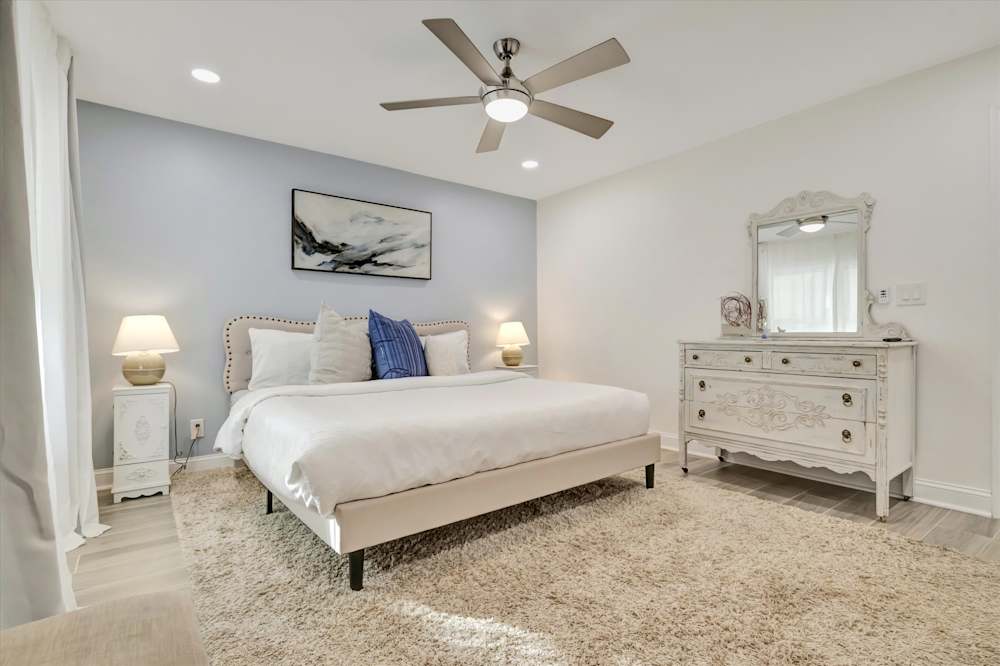 Spacious bedroom with storage and soft lighting