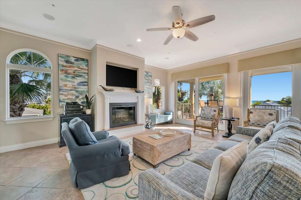 Open layout living room with fireplace and an oceanview