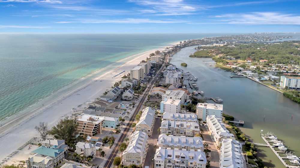 Coastal aerial with beach and canal views